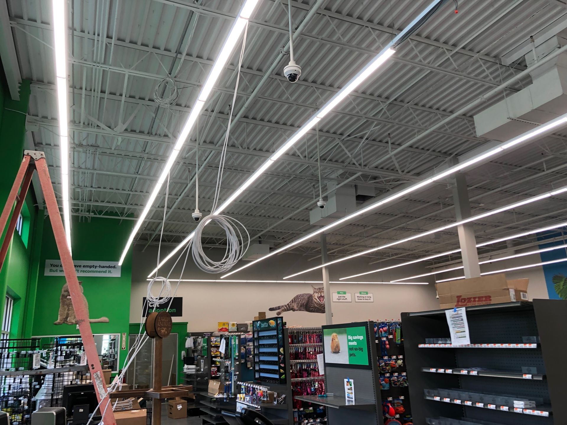 a ladder is hanging from the ceiling of a store