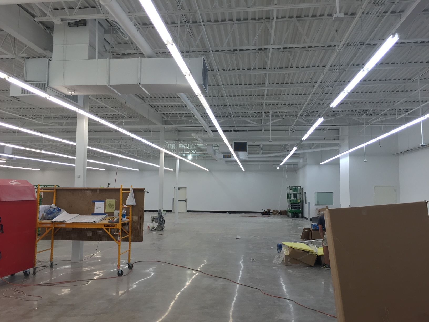 a large empty room with lots of lights on the ceiling