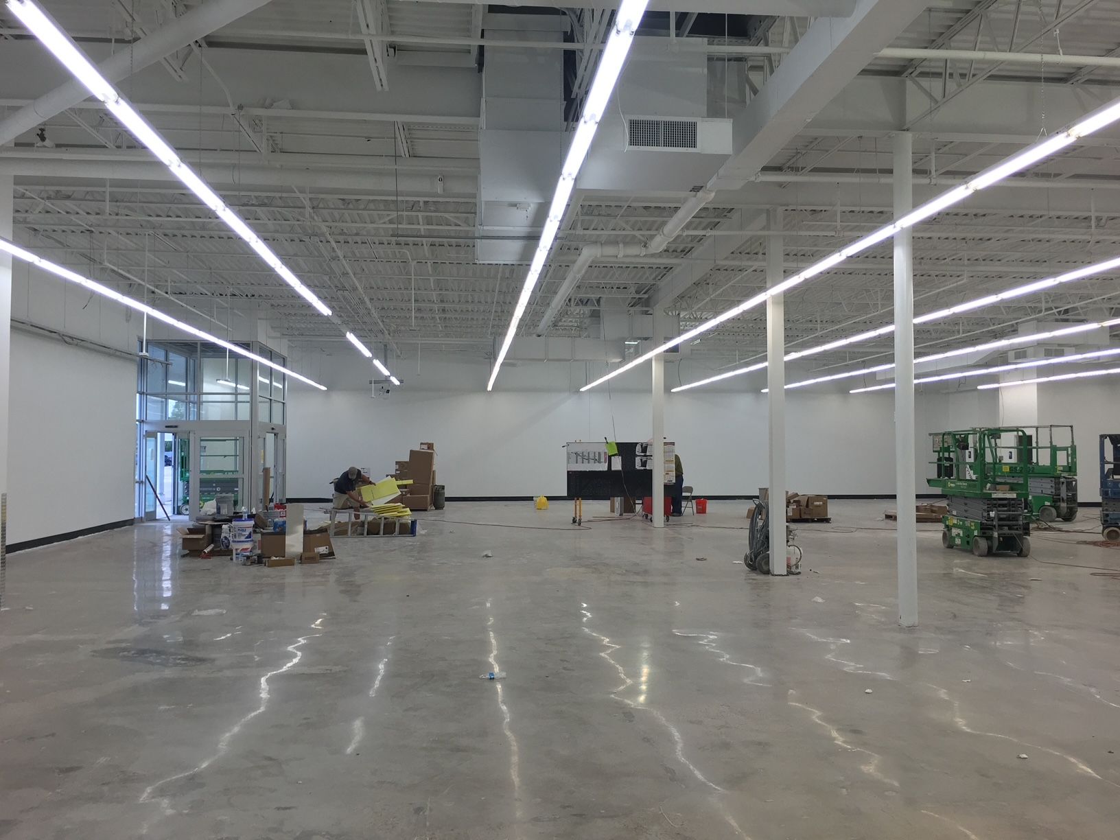 a large empty room with a lot of lights on the ceiling