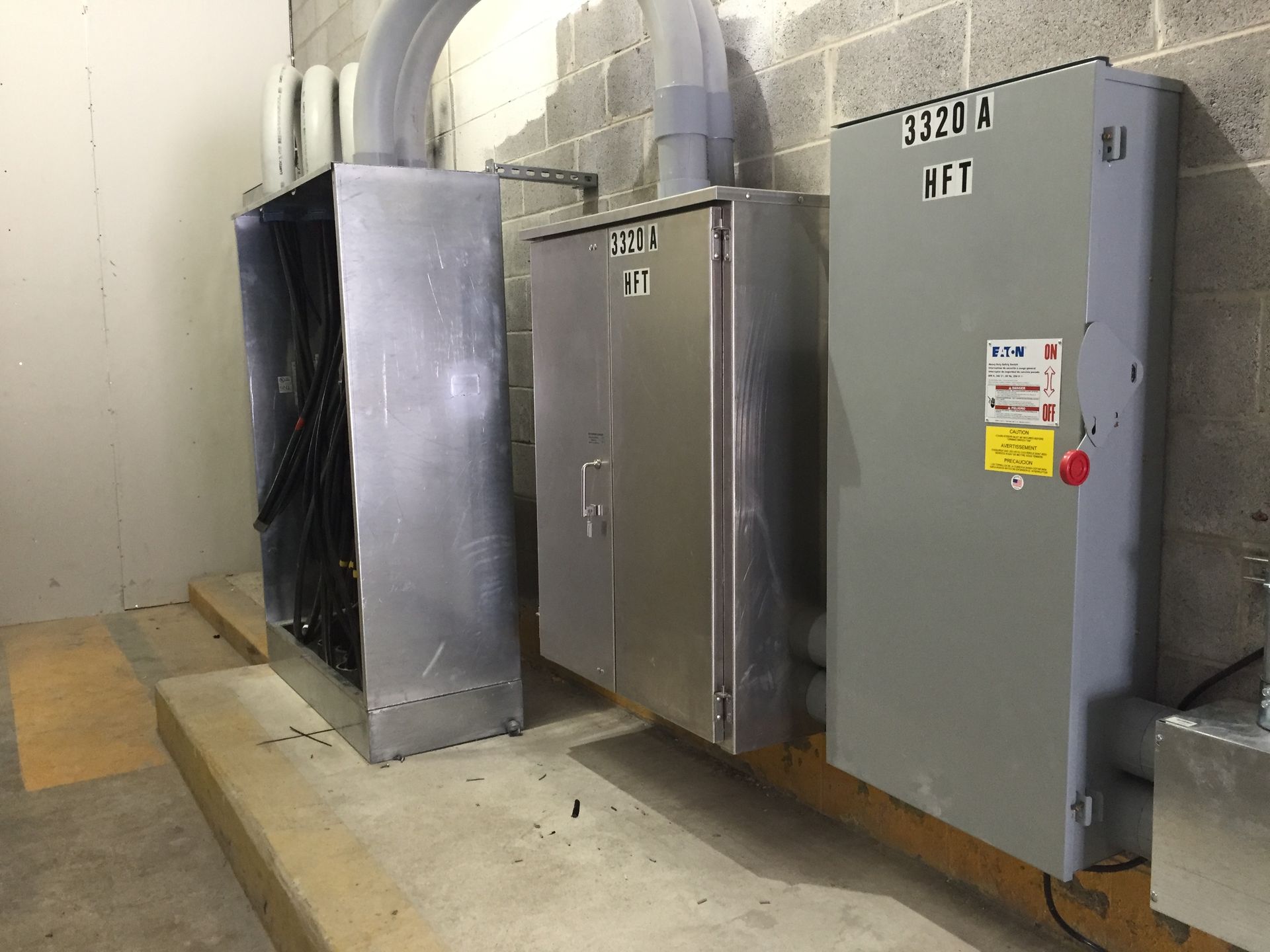 a room with a lot of electrical boxes on the wall 