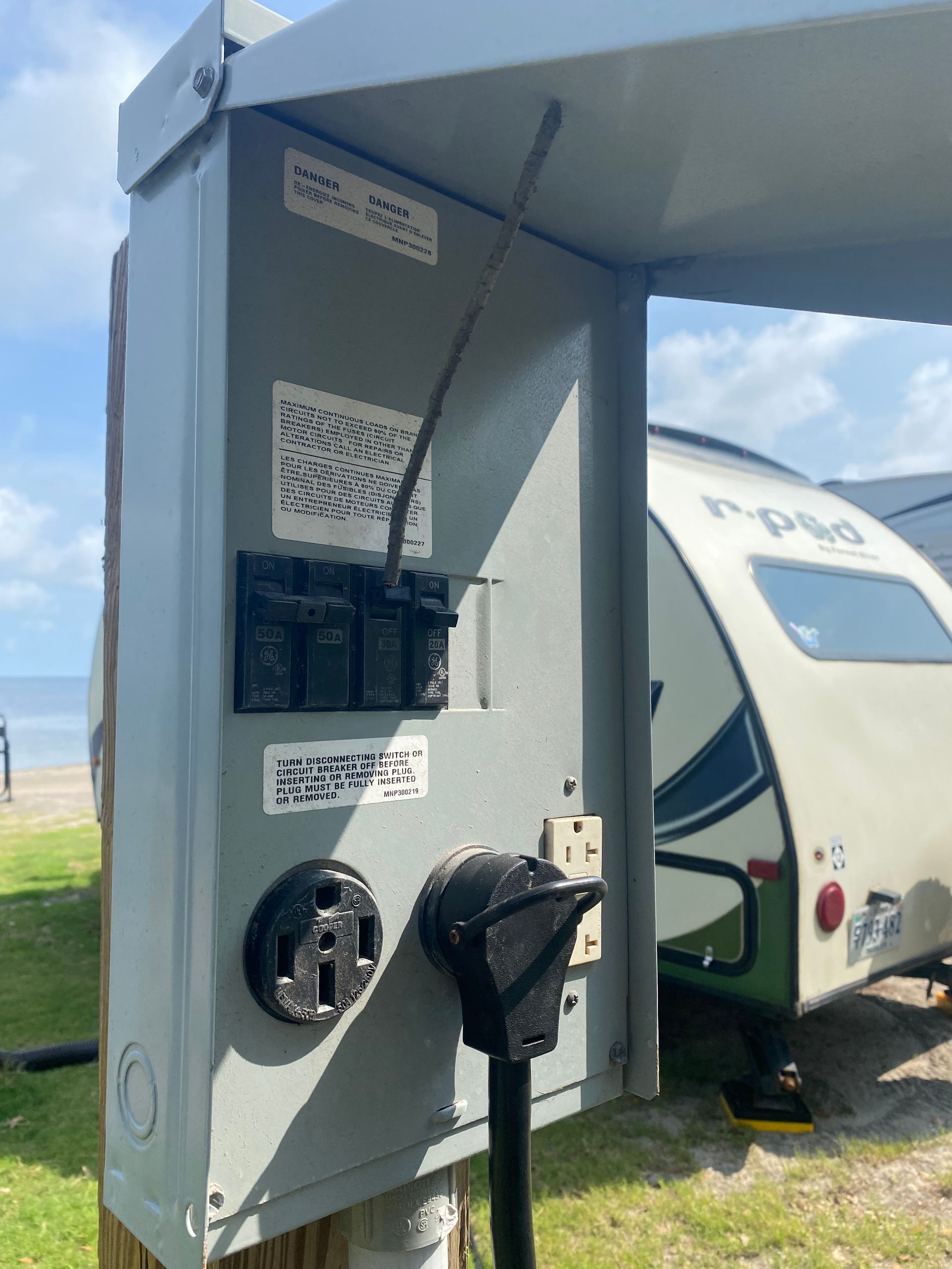 a rv is parked next to a power box