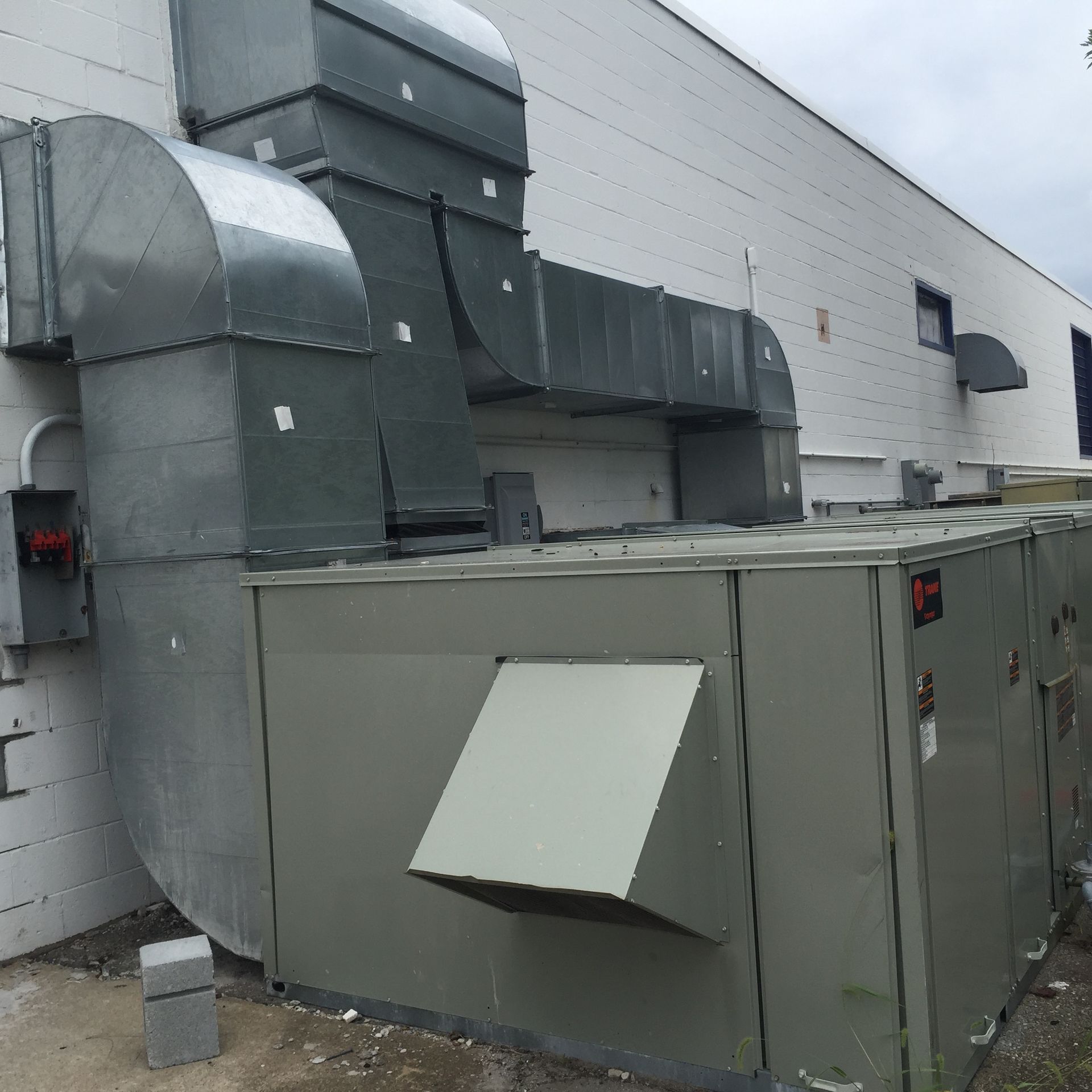 a building with a lot of ducts coming out of it