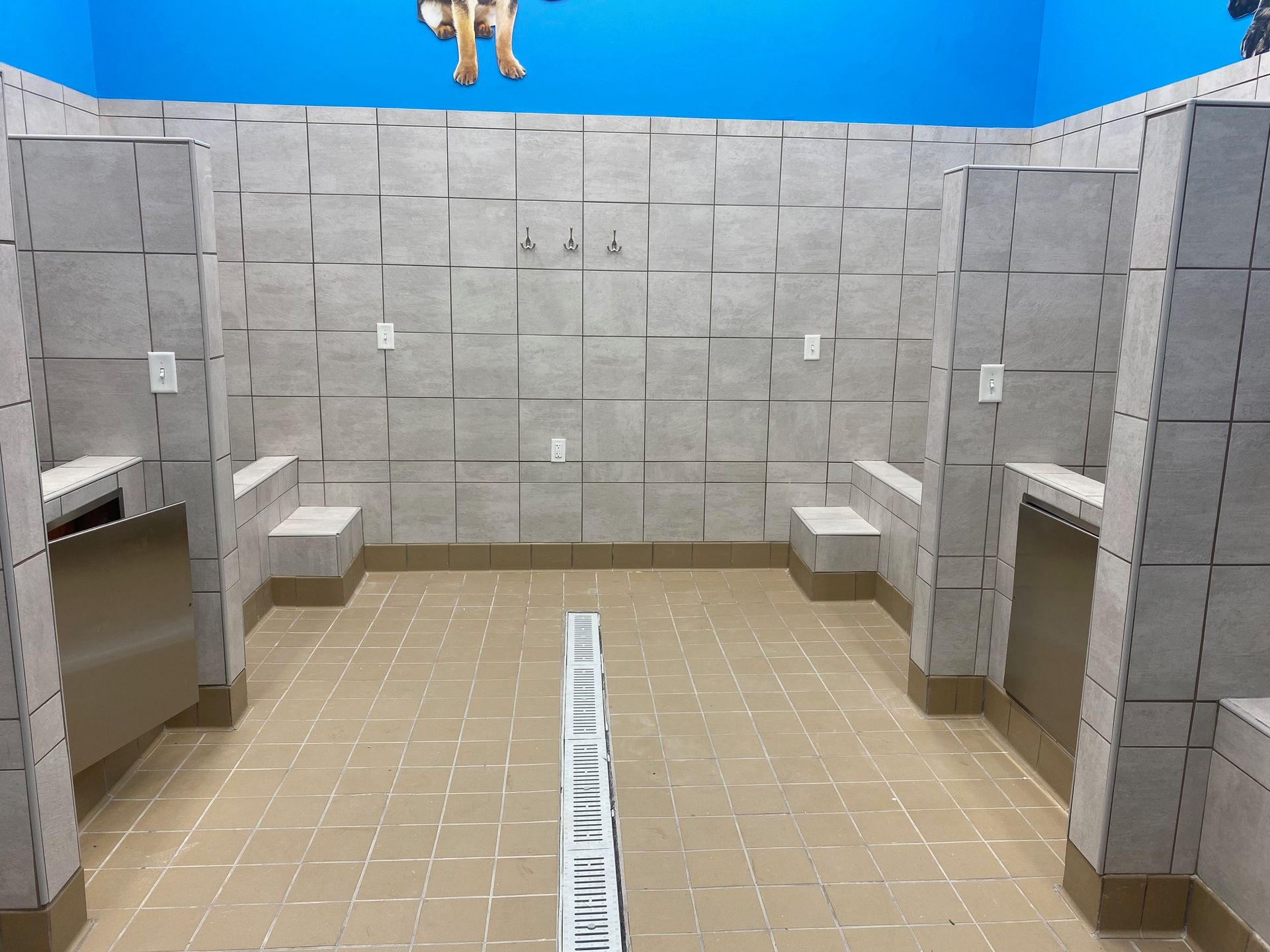 a bathroom with a drain in the middle of it