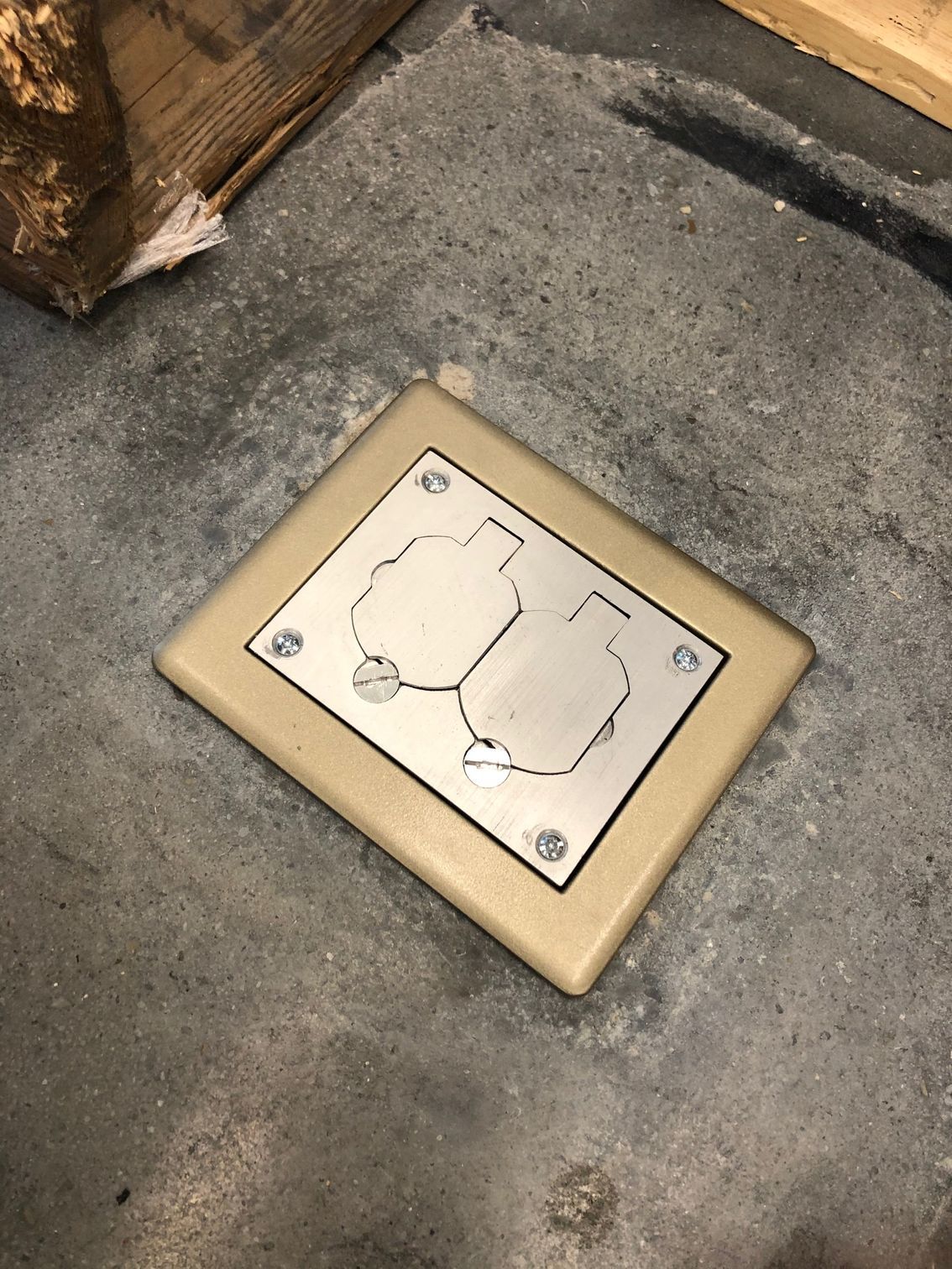 a light switch is sitting on a concrete floor