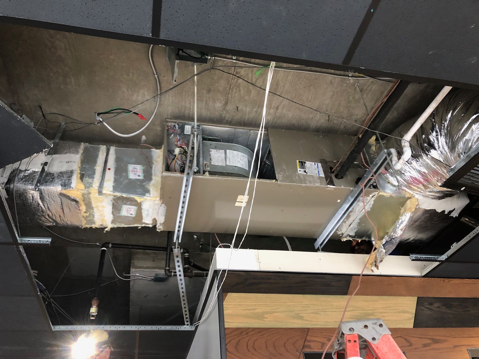 a ladder is hanging from the ceiling of a building