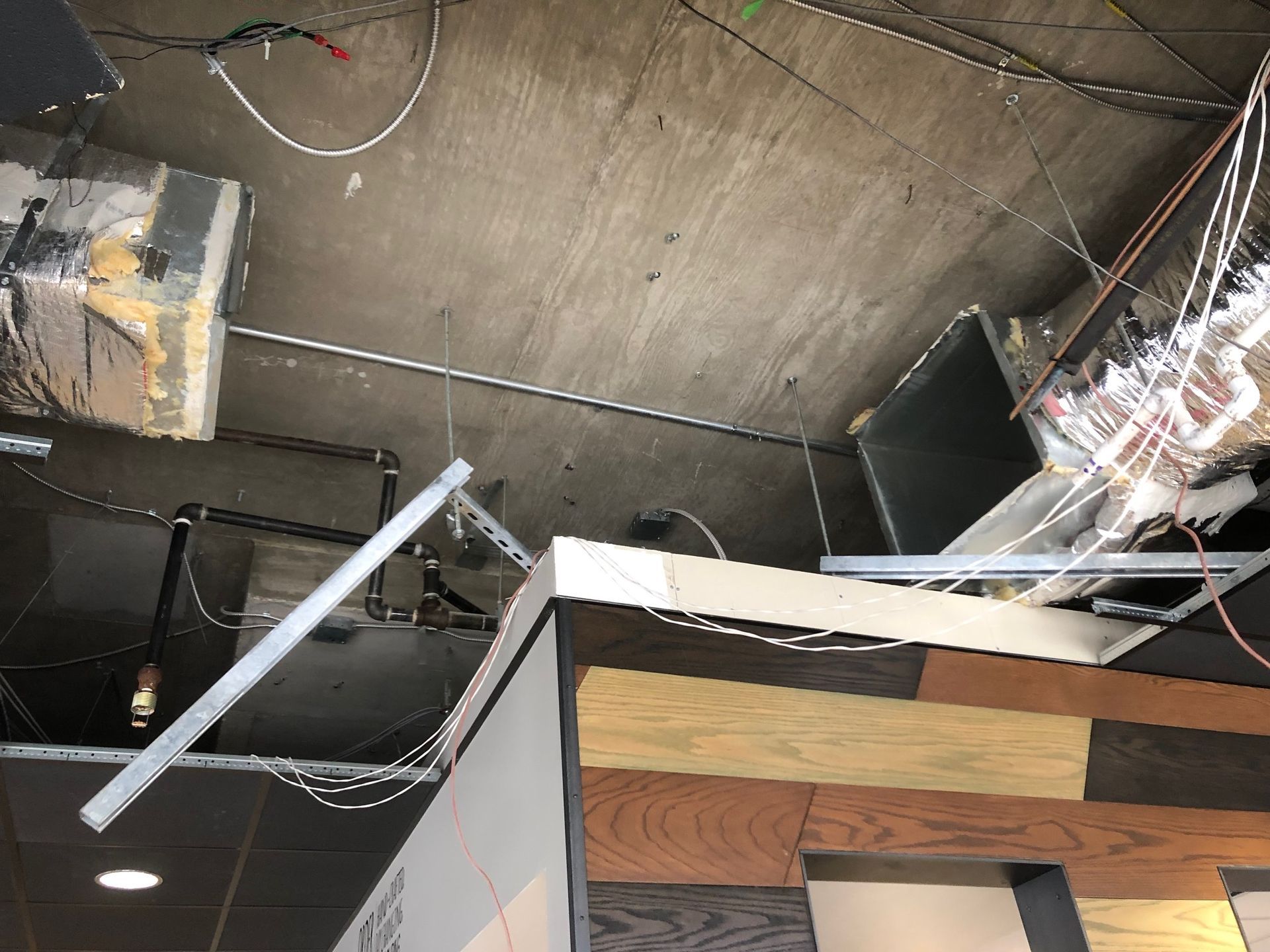 a ceiling with a lot of wires hanging from it