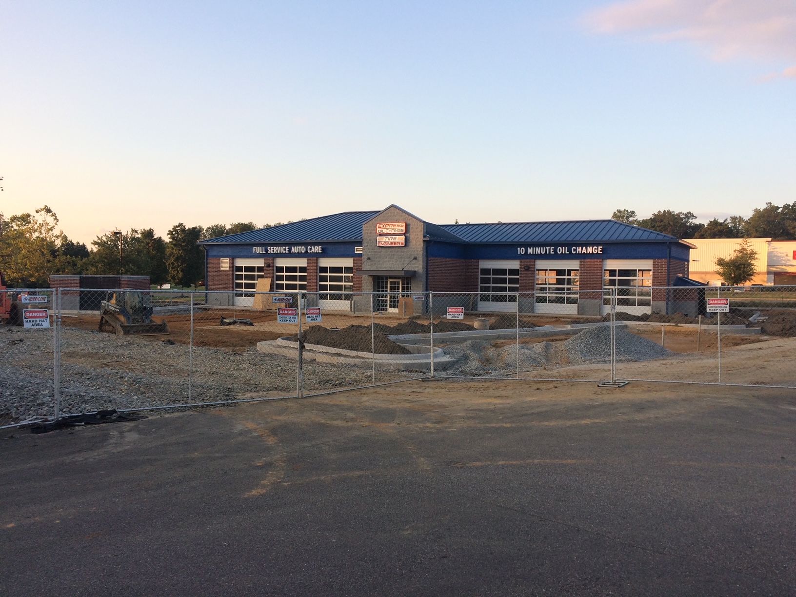 a building under construction with a fence around it