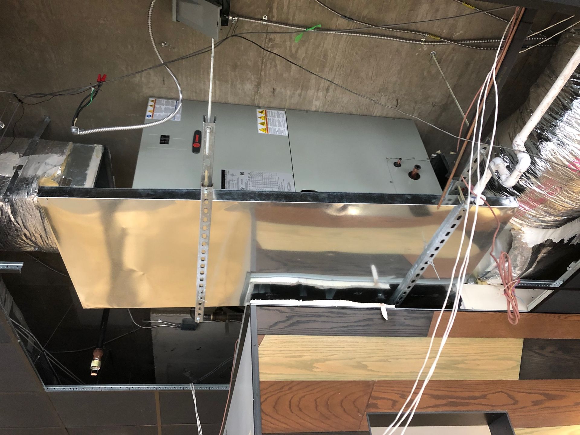 a ceiling with a lot of wires hanging from it