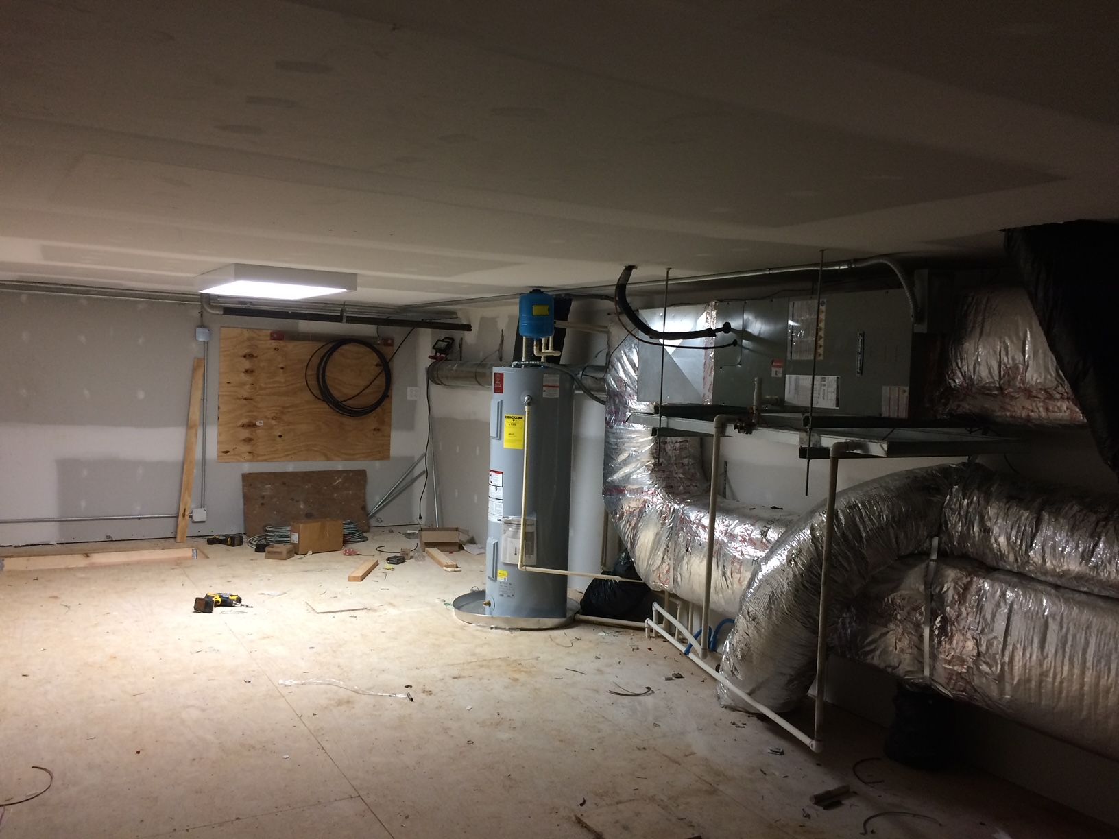 there is a water heater in the middle of the room