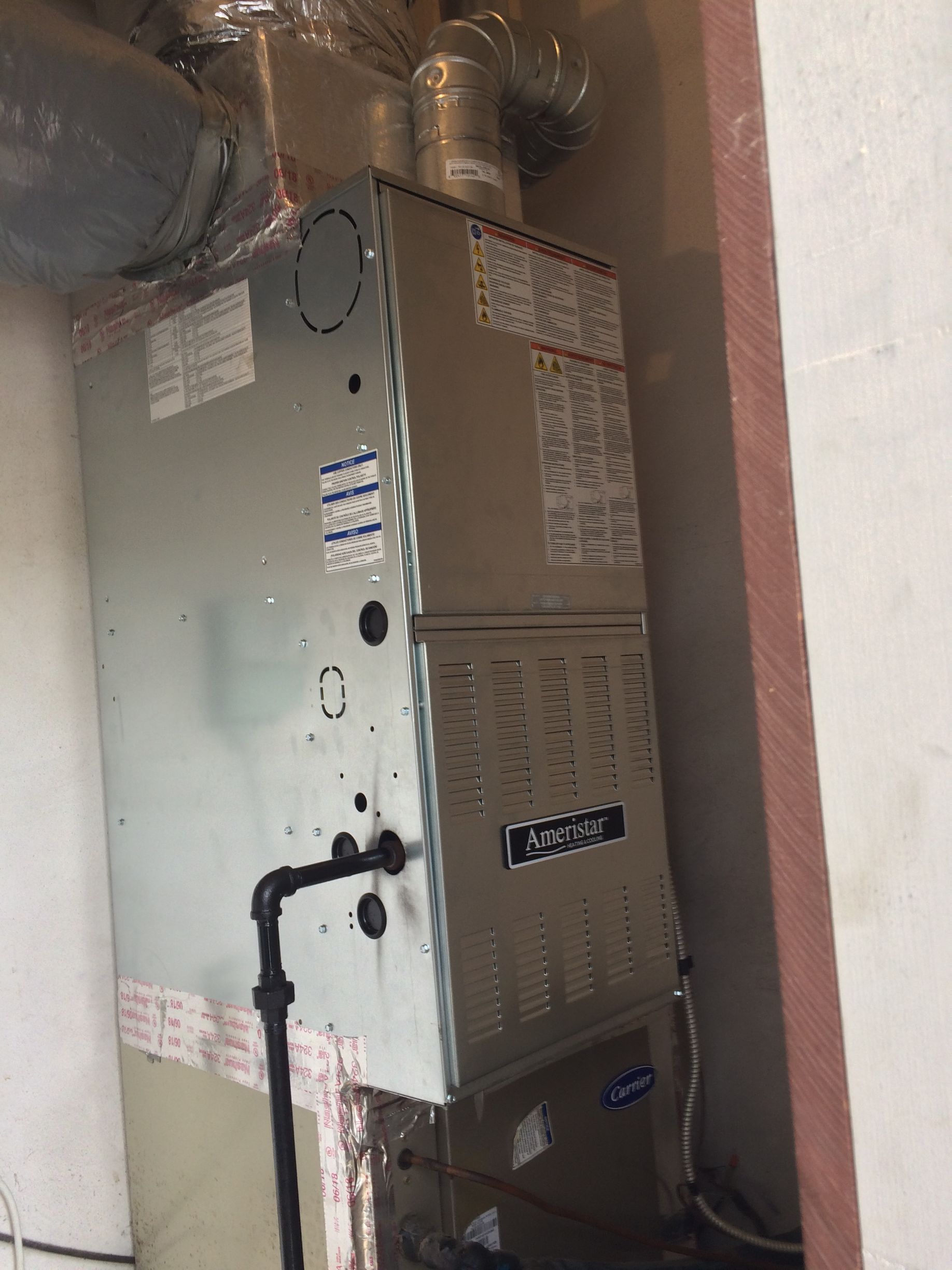 an air conditioner is sitting in a corner of a room 