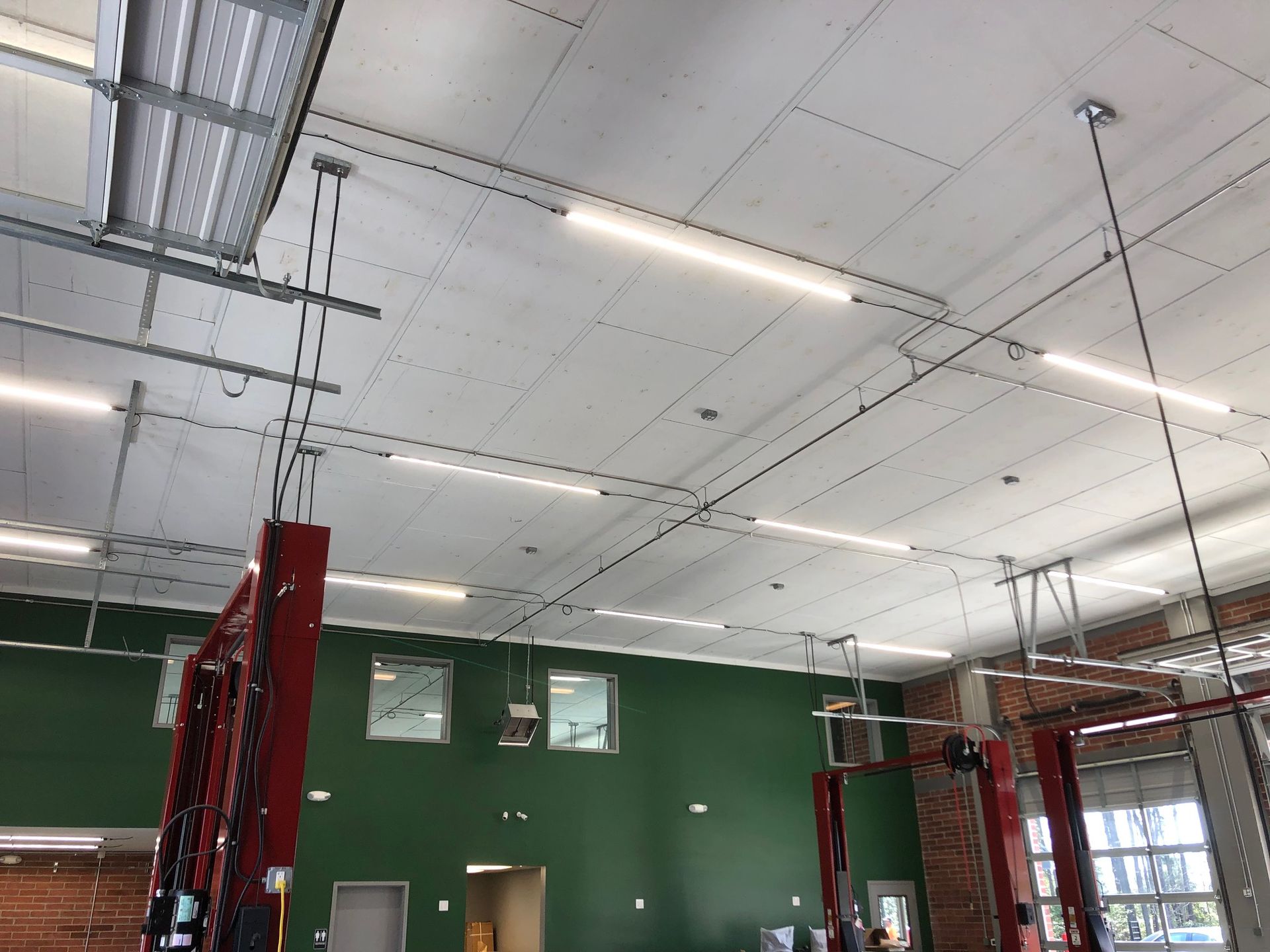 a large room with a lot of lights hanging from the ceiling