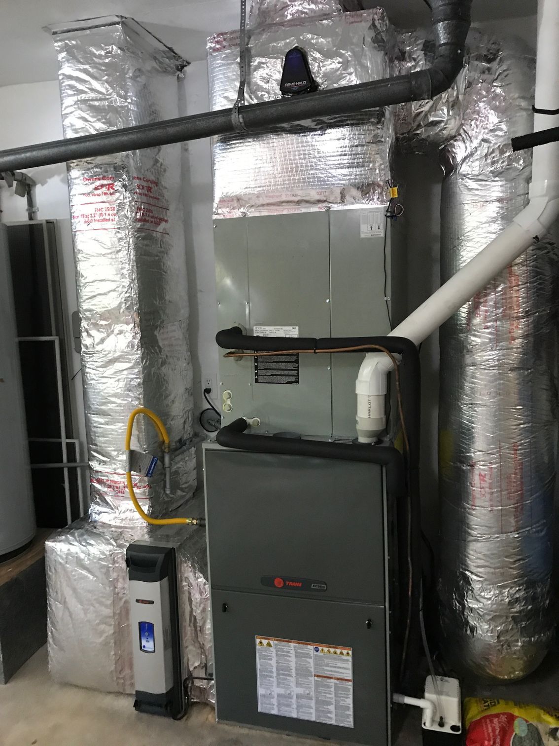 a heating and cooling system is installed in a basement 
