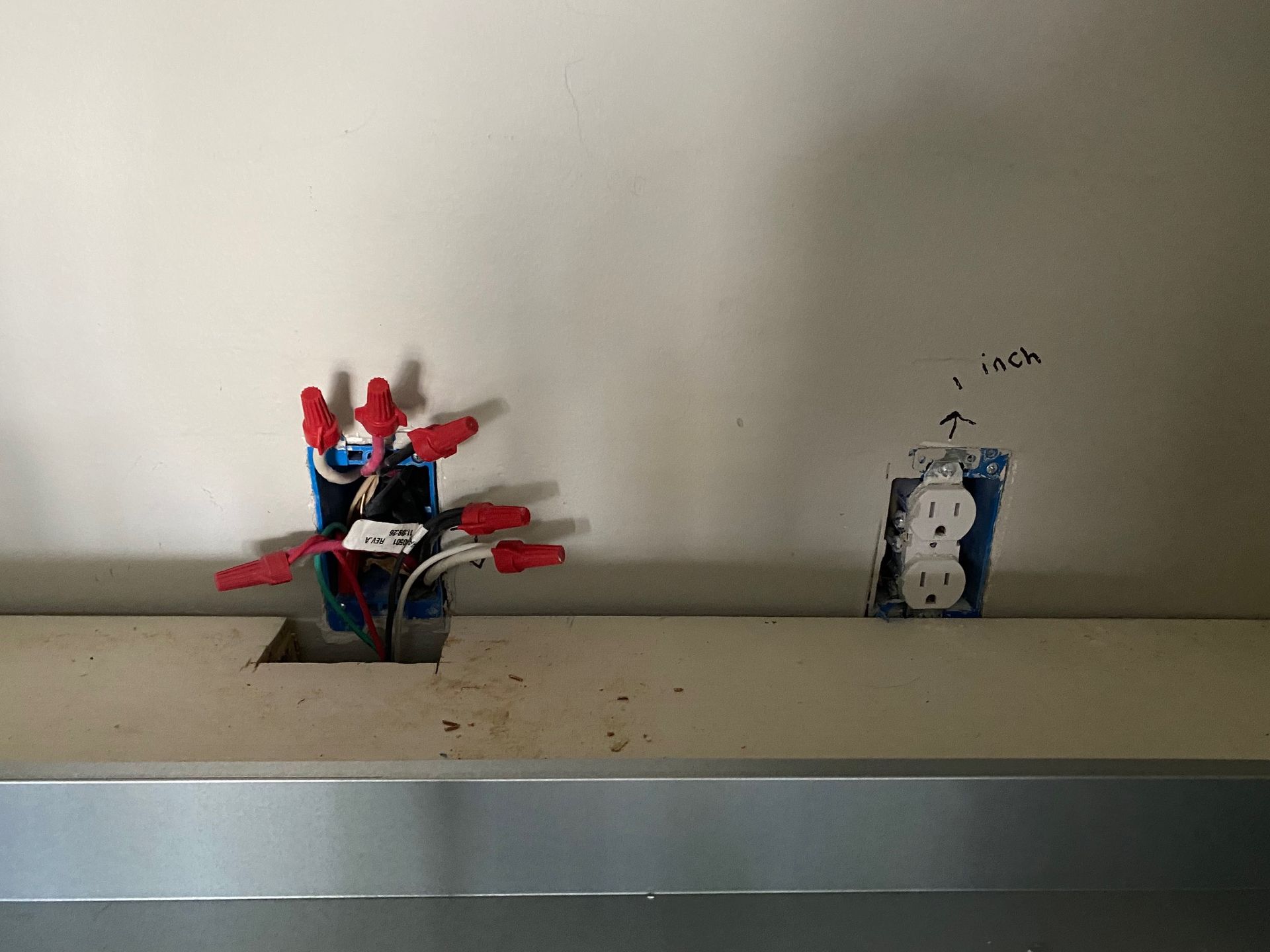 two electrical outlets are being installed on a wall