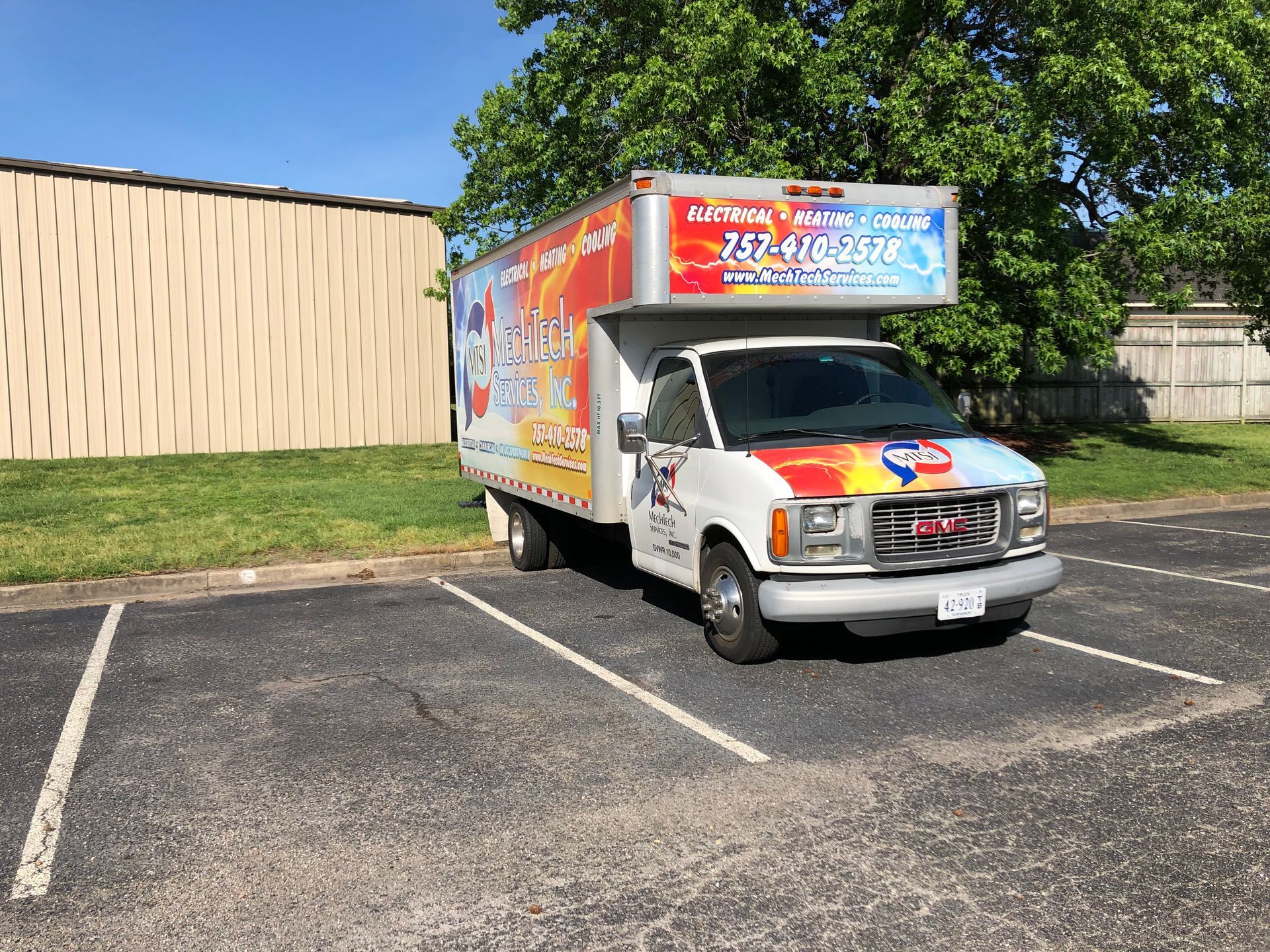 a truck is parked in a parking lot in front of a building