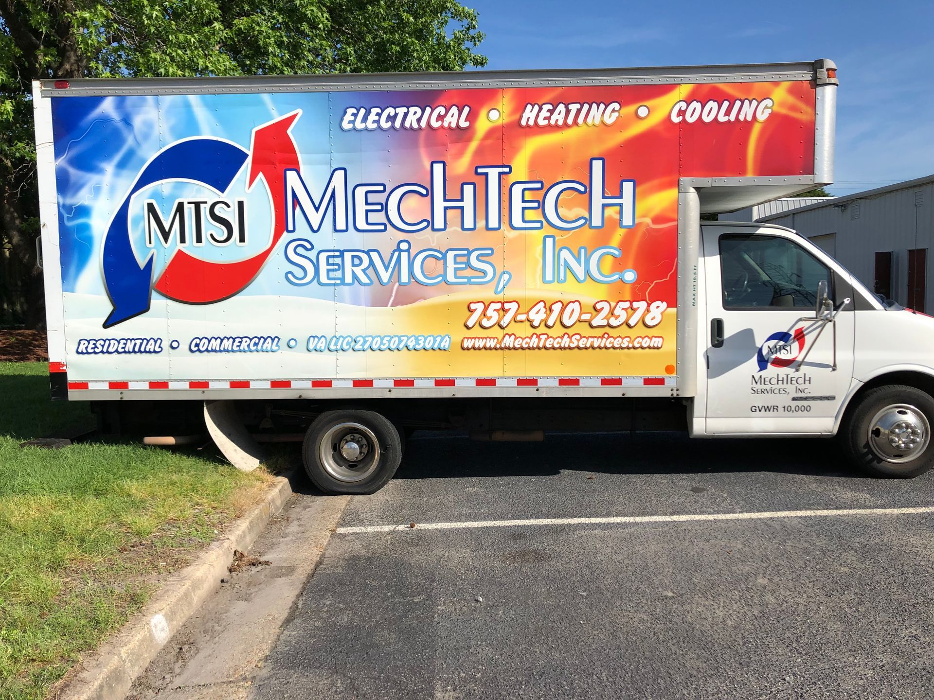 a mechtech services truck is parked in a parking lot