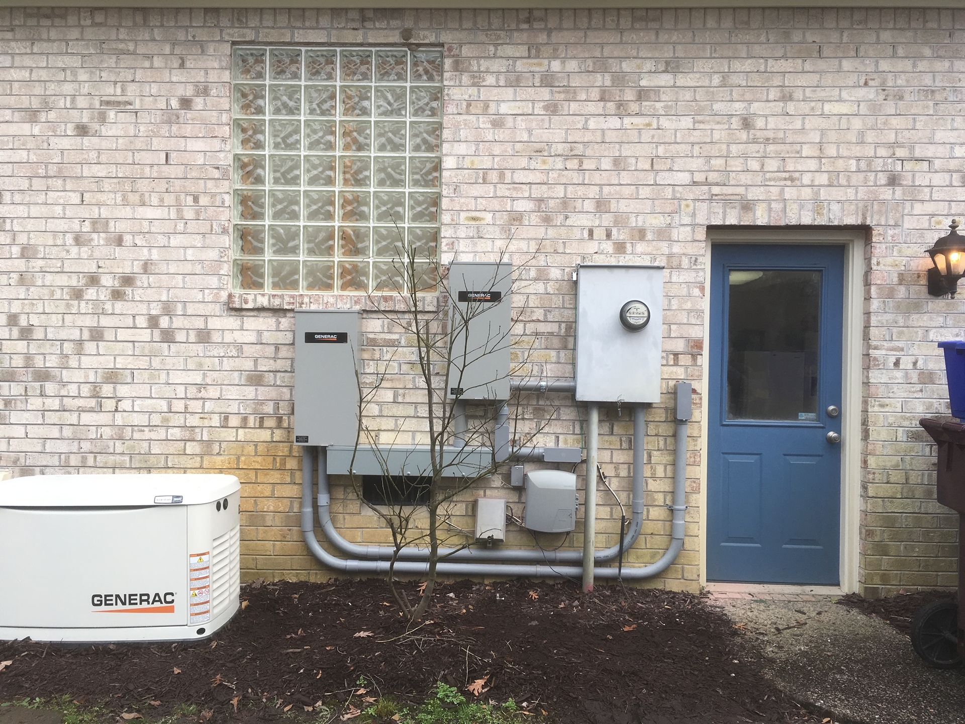 a generator is installed on the side of a brick building
