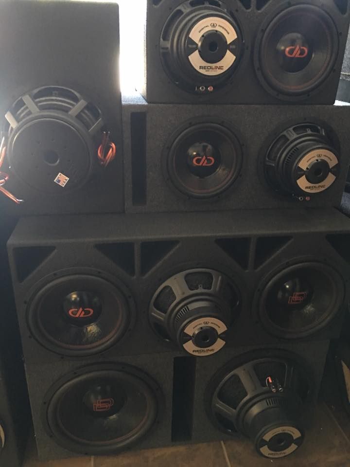 A bunch of speakers stacked on top of each other