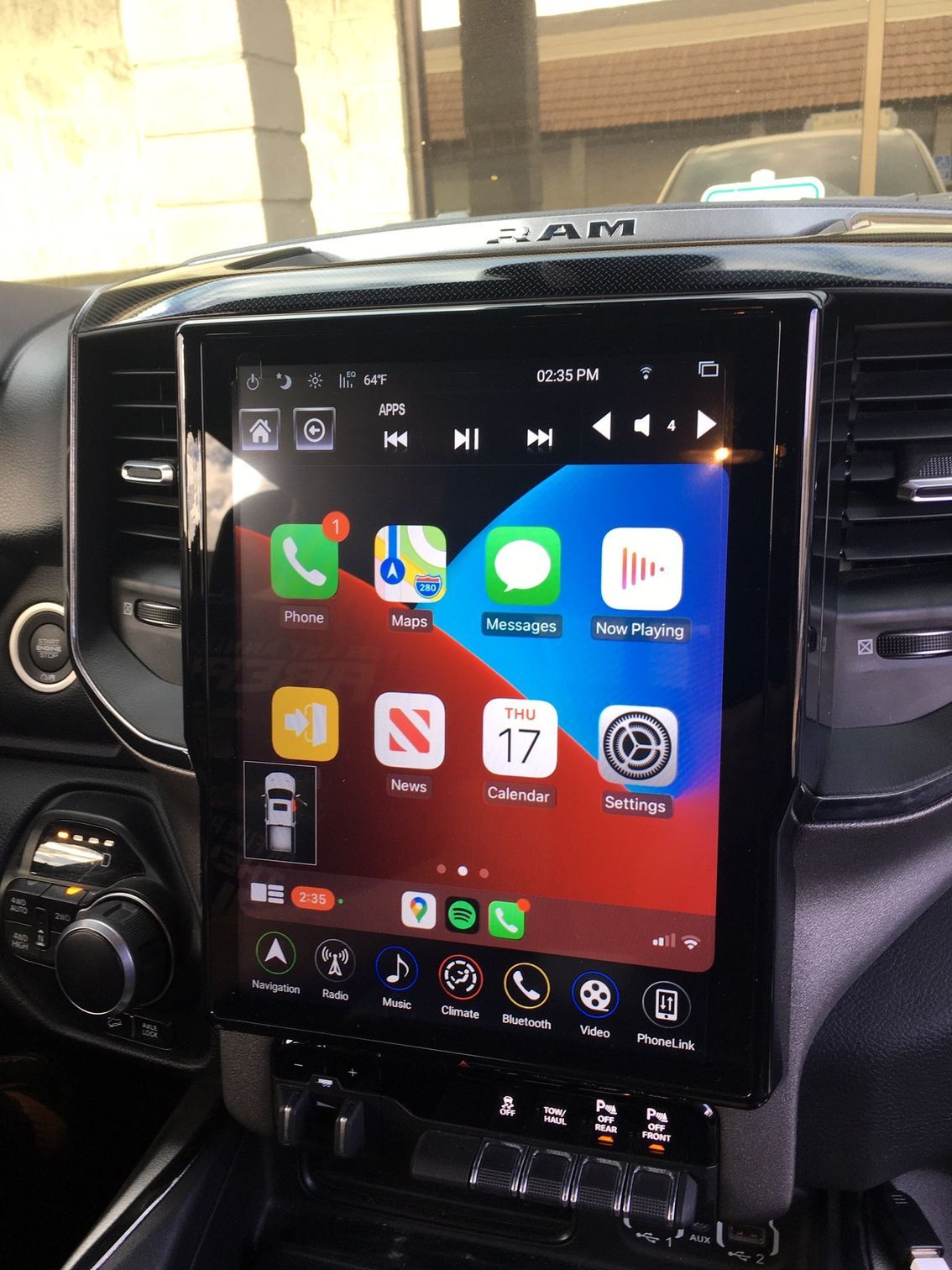 A car dashboard with a ram logo on it