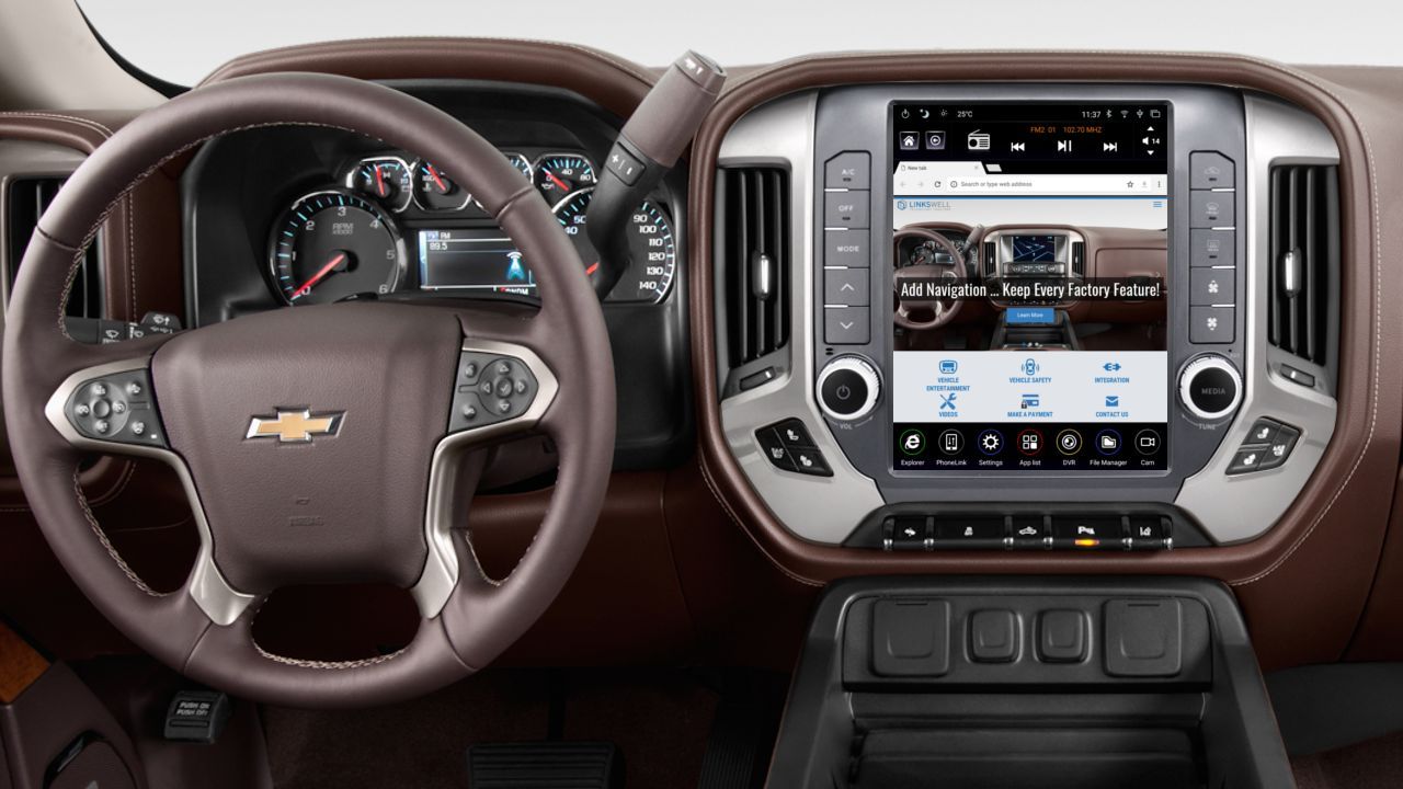 The interior of a chevrolet silverado truck with a steering wheel and a dashboard.