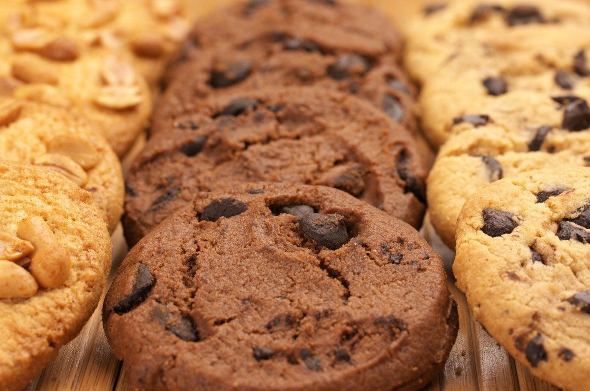 There are many different types of cookies on the table.