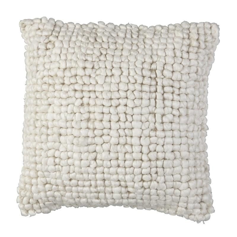 A white pillow with a knitted pattern is on a white background.