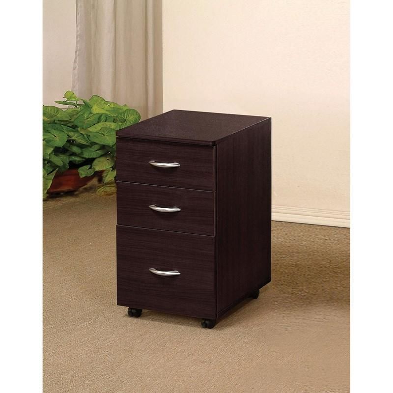 A small wooden cabinet with four drawers is sitting on a carpeted floor in a room.