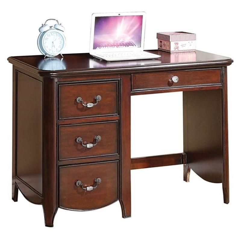 A wooden desk with a laptop and an alarm clock on it