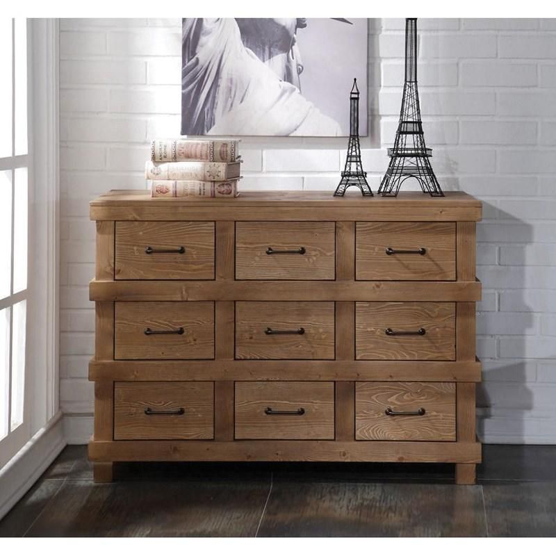 A wooden dresser with a picture of a woman and a eiffel tower on top