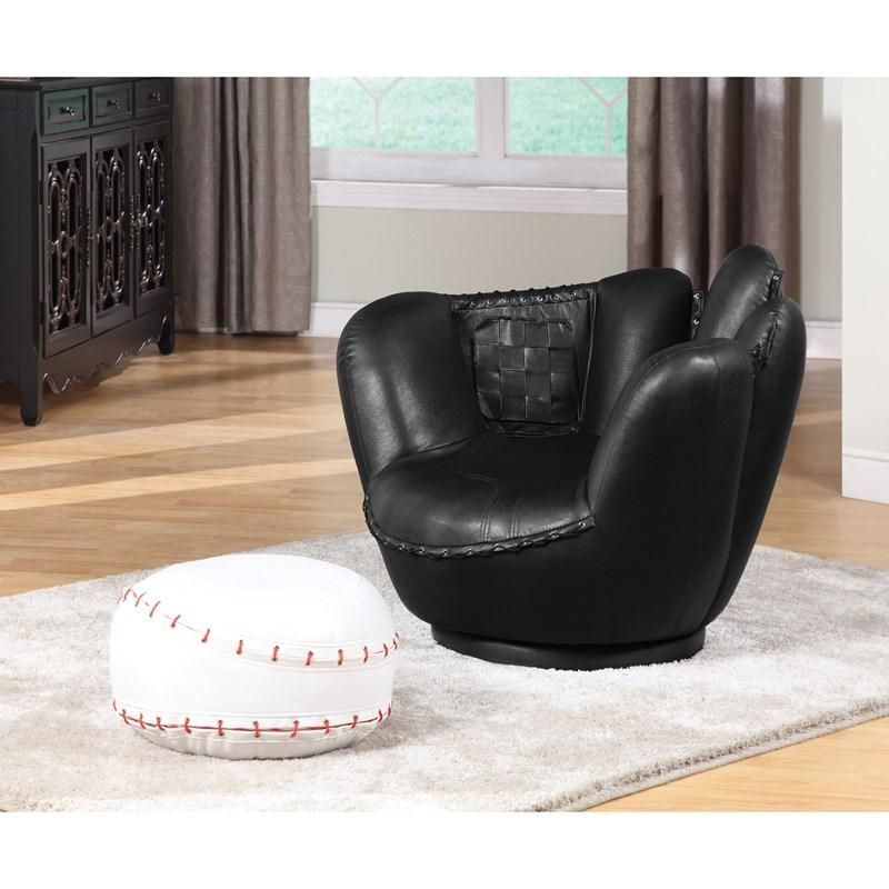 A baseball shaped ottoman sits next to a black chair