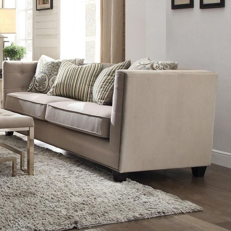A living room with a couch and a rug