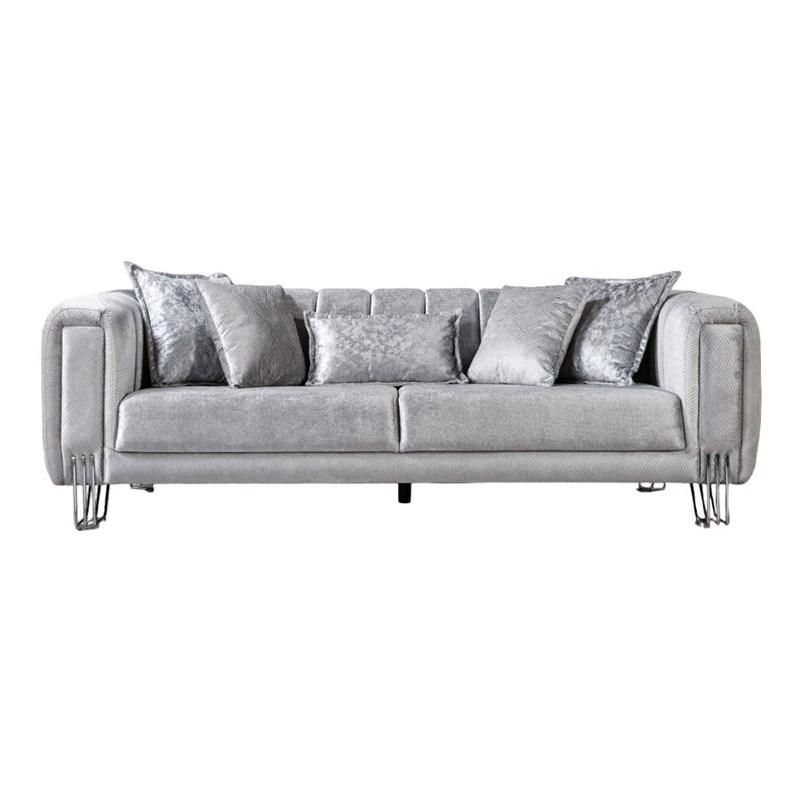 A grey couch with silver pillows on a white background.