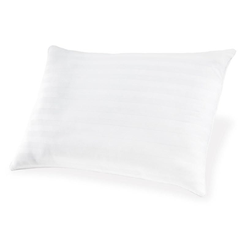 A white pillow is sitting on a white surface.