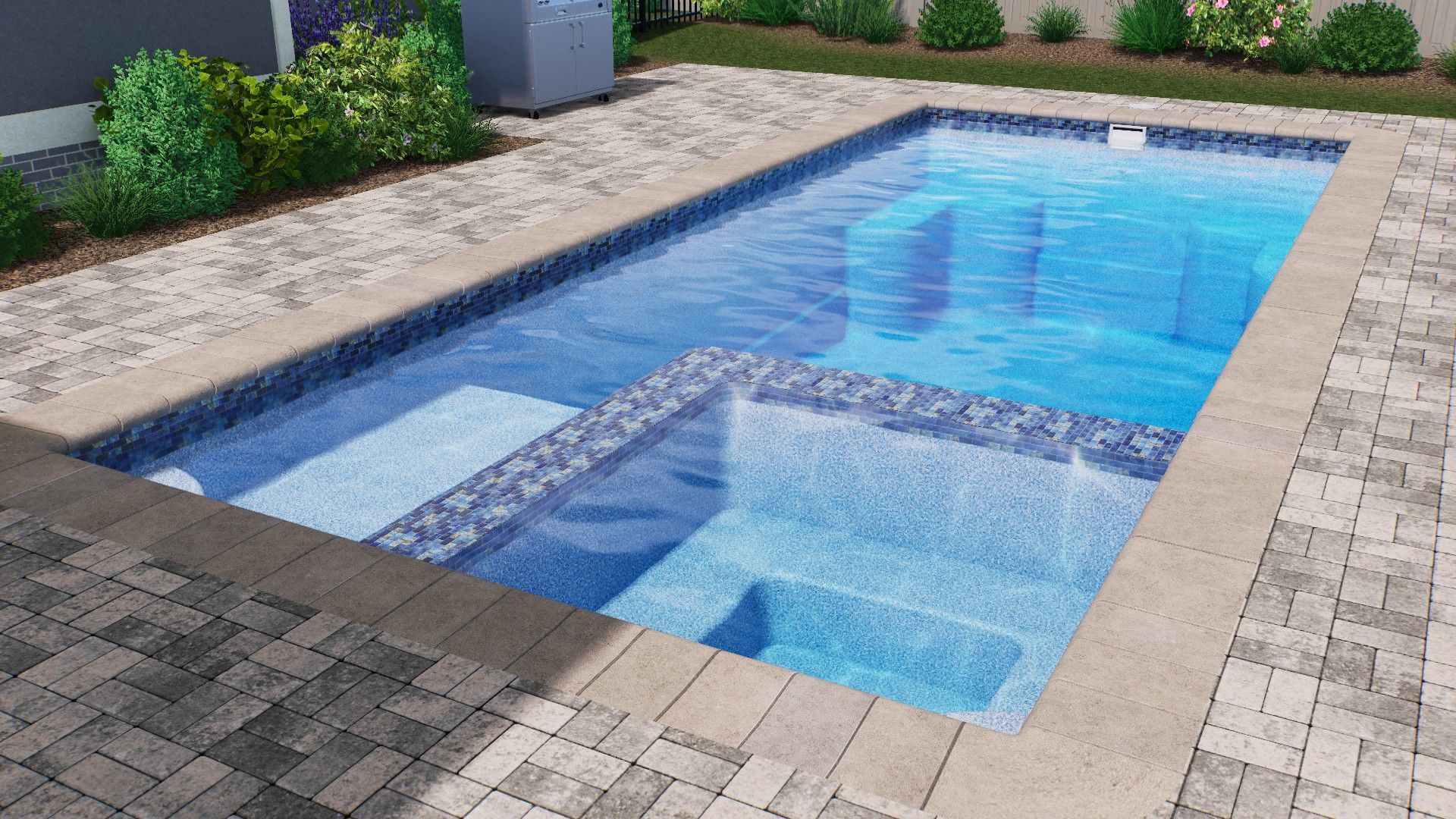 Rectangular swimming pool with spa section, blue water, stone deck. Green shrubs and sky in background.