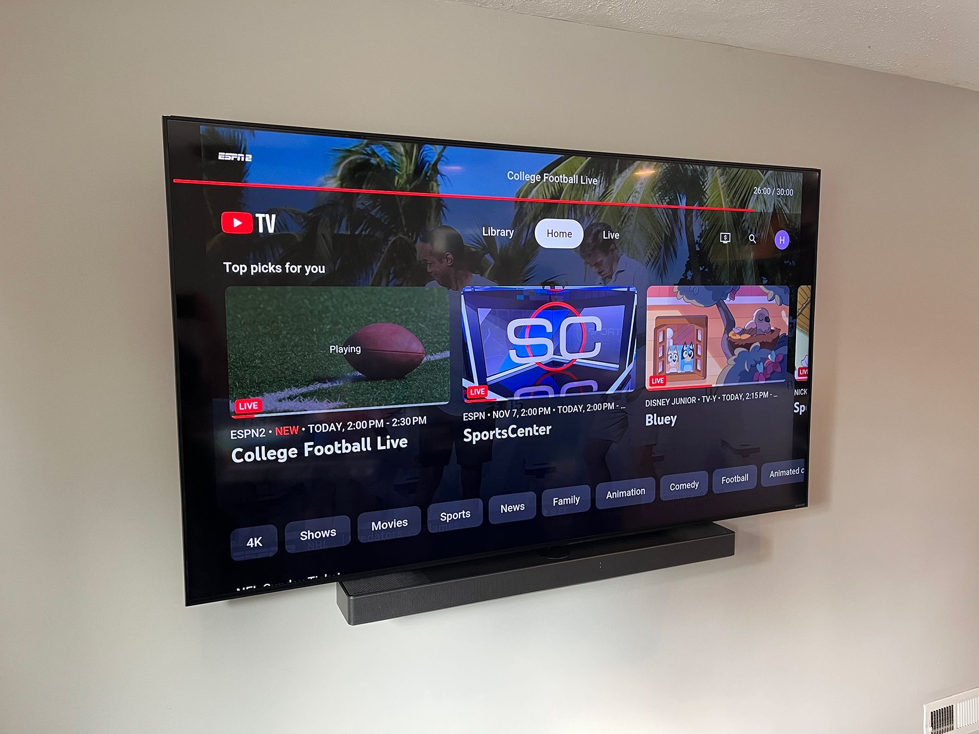 TV screen showing college football