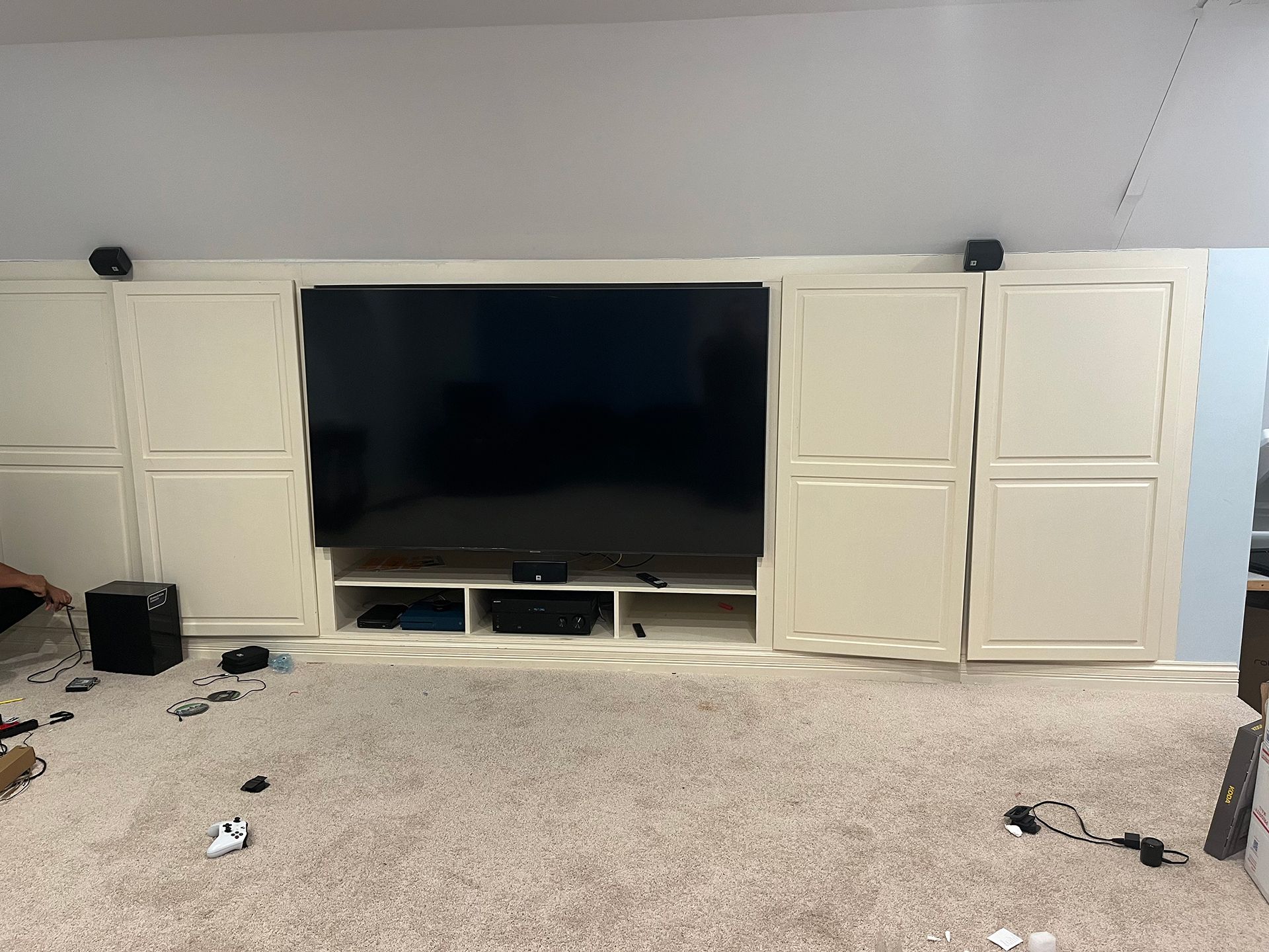 TV surrounded by cabinets