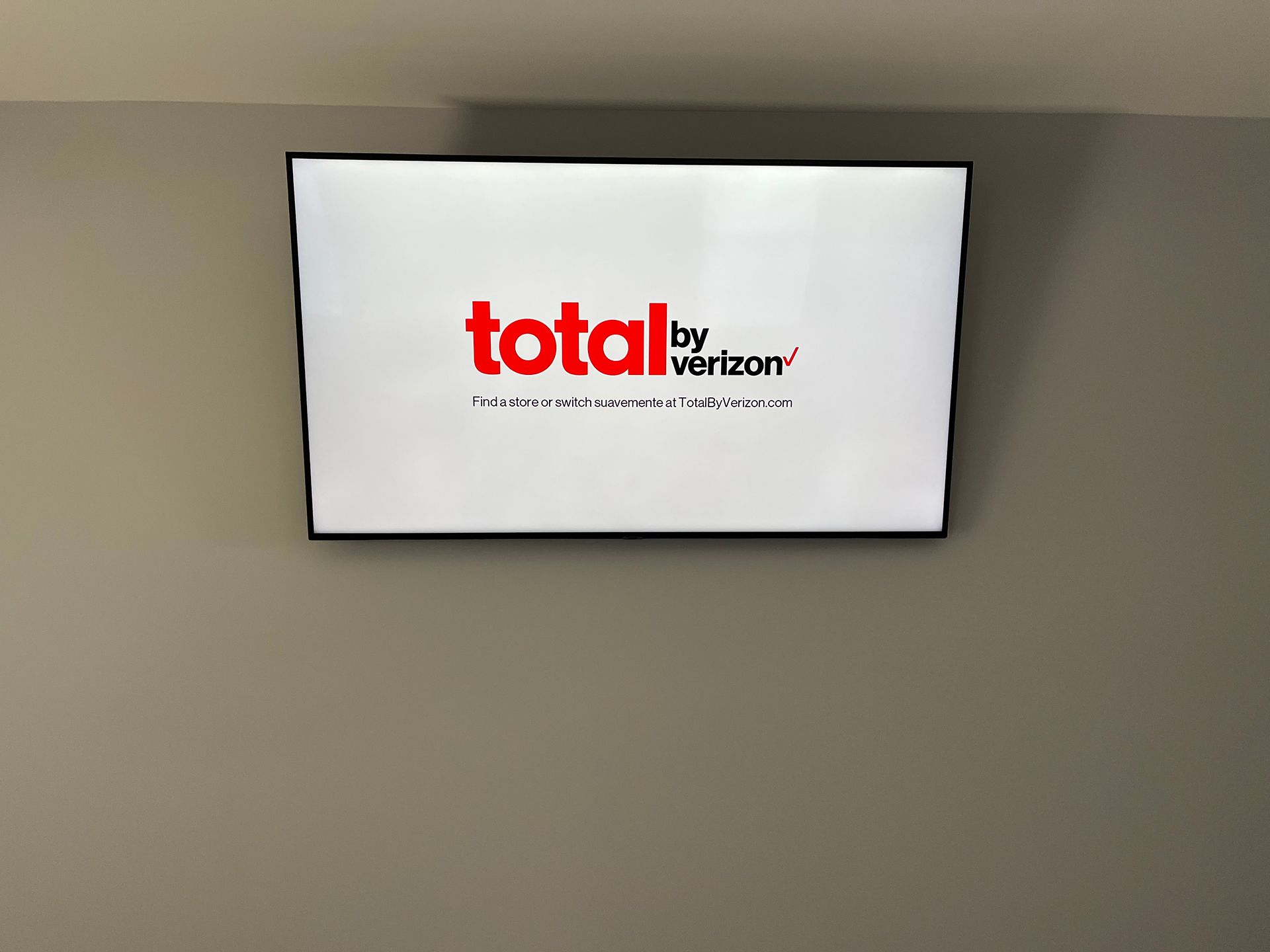 A flat screen TV mounted to a wall