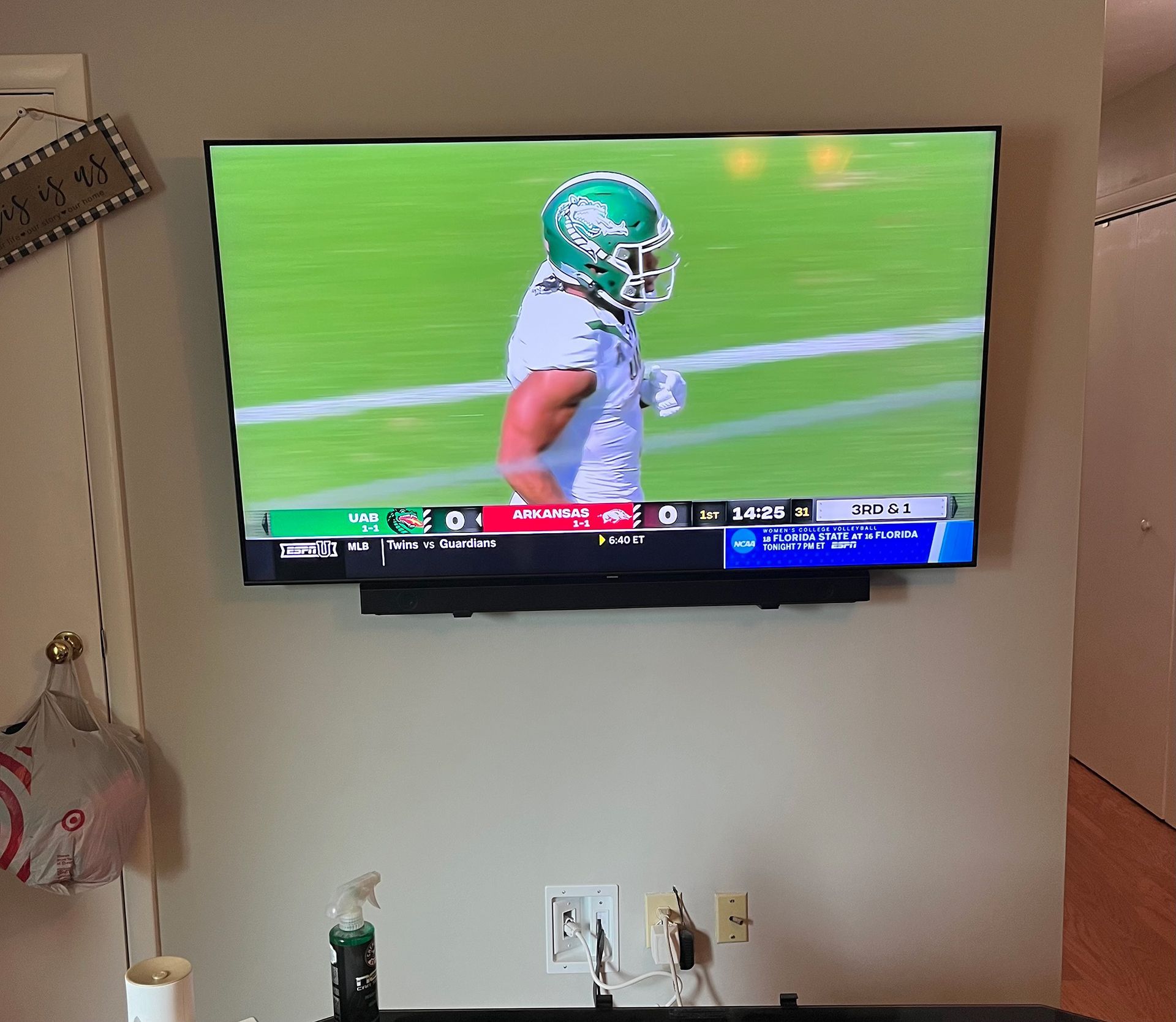 TV screen showing an American football player