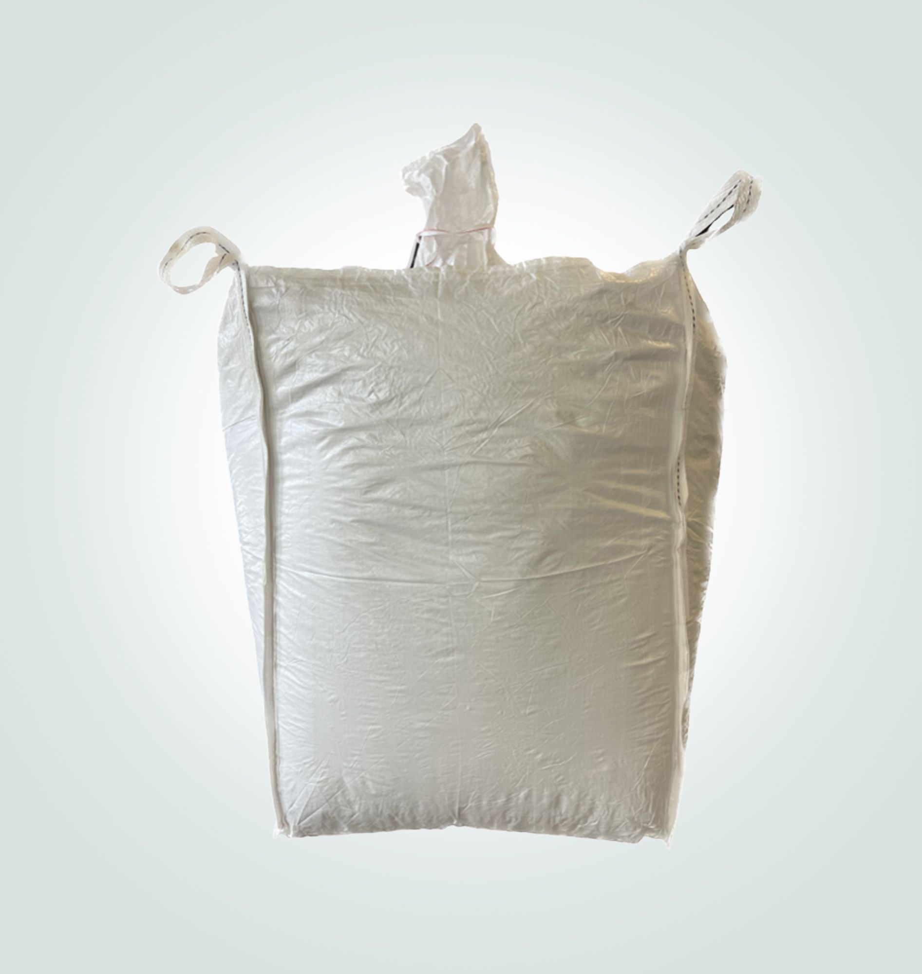 White woven plastic sack with handles on a plain light background