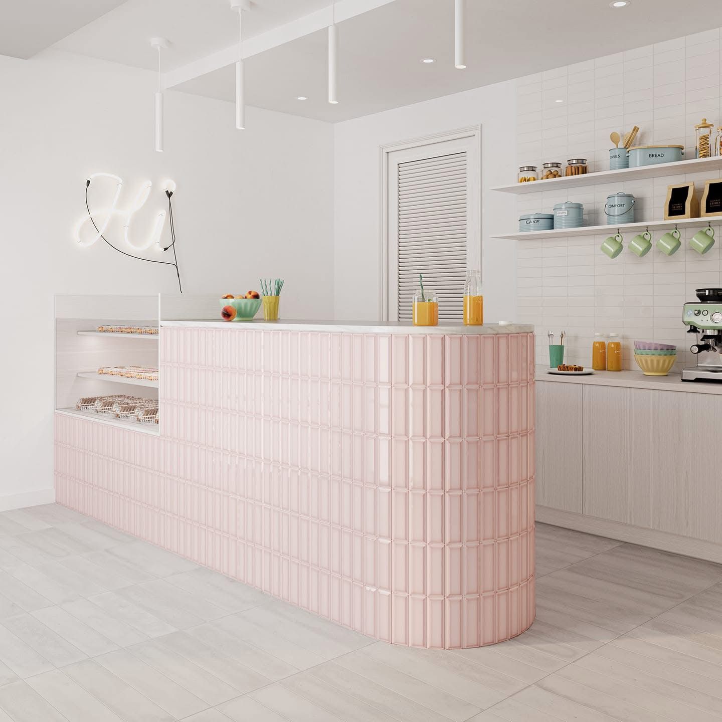 A kitchen with a pink counter top and white cabinets.