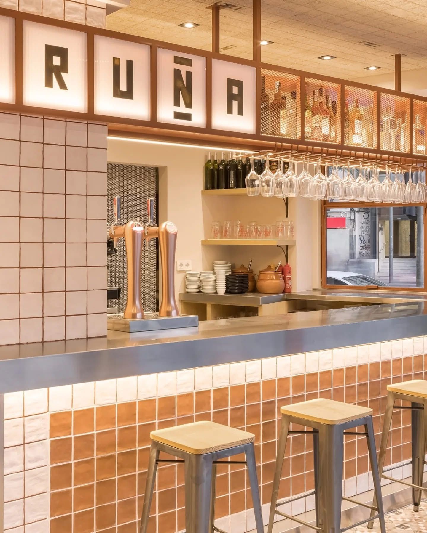 Interior of a modern and cozy bar or café.