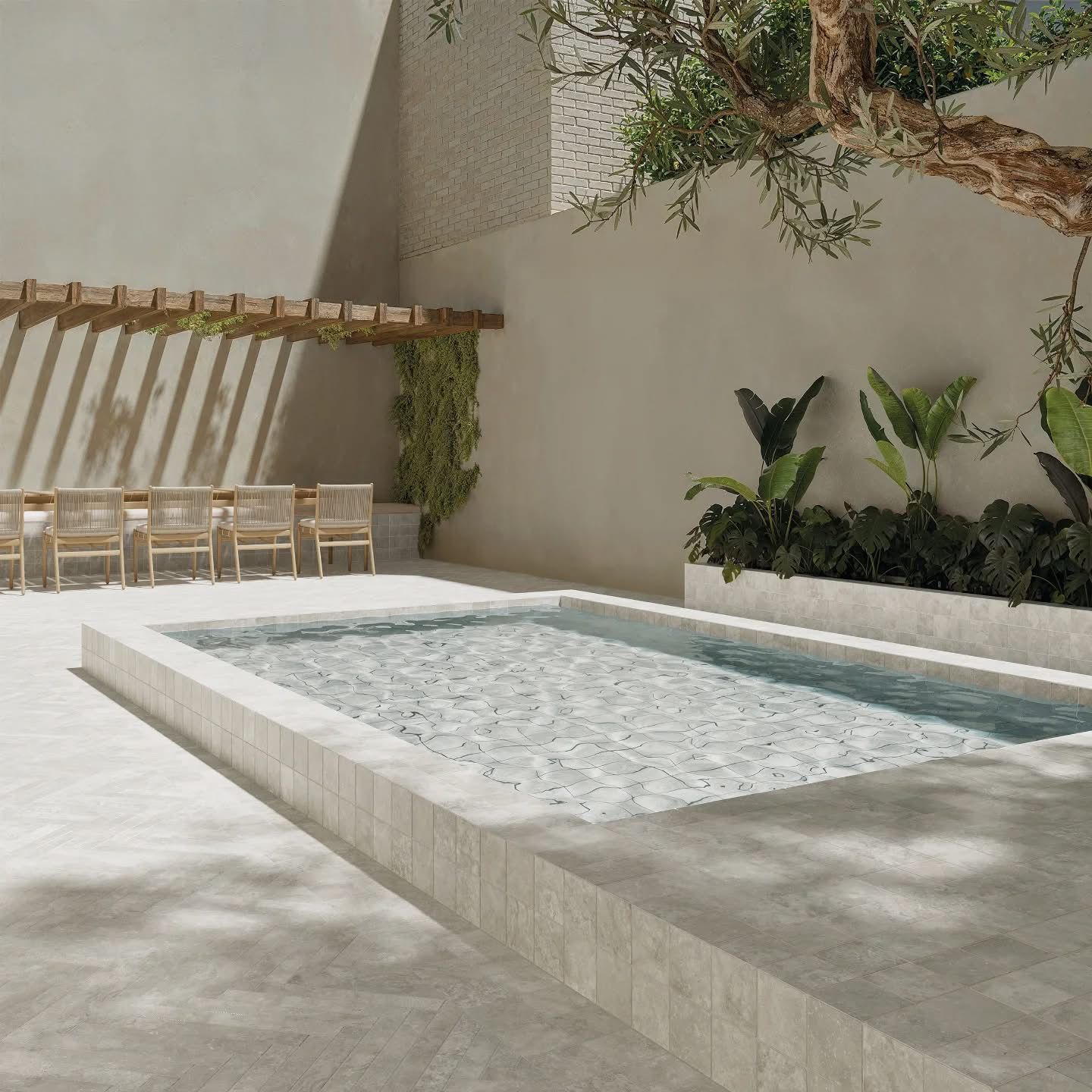 A large swimming pool surrounded by chairs and plants