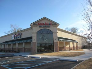 A large building with a lot of windows and a sign that says campbell 's dry supply