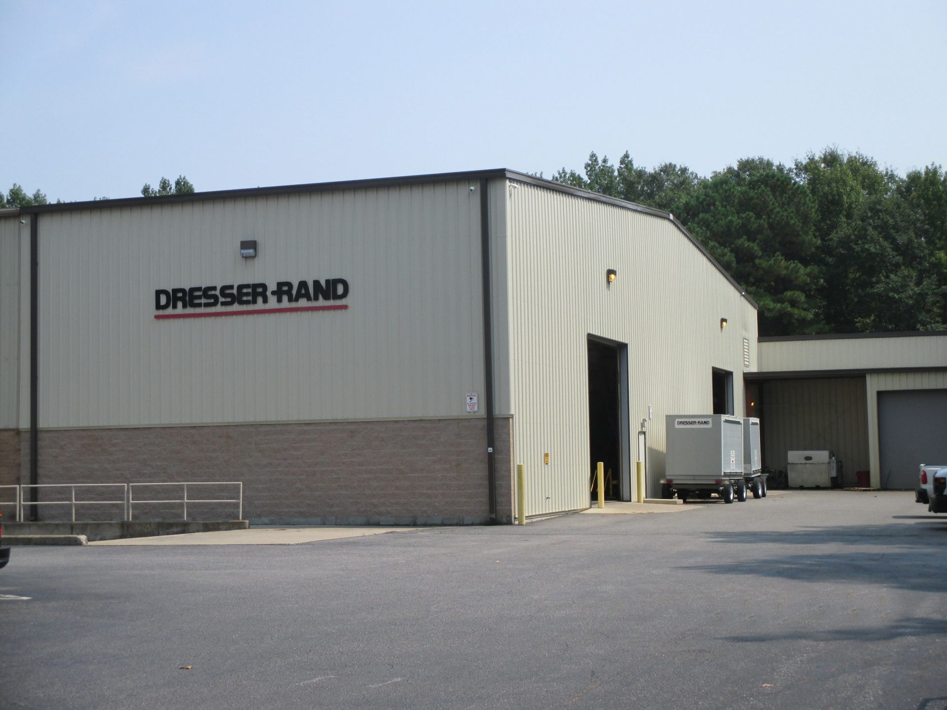 A large building with a sign that says dresser rand