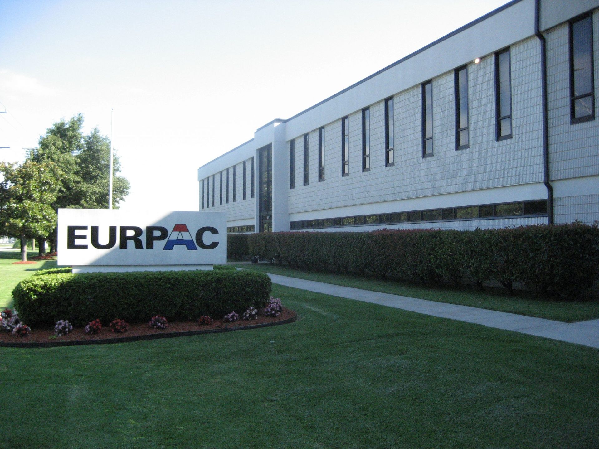 A large white building with a sign that says eurpac