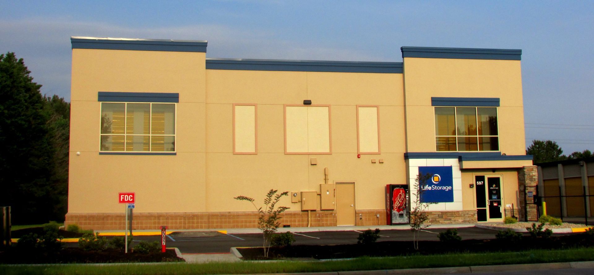 A building with a pepsi vending machine in front of it