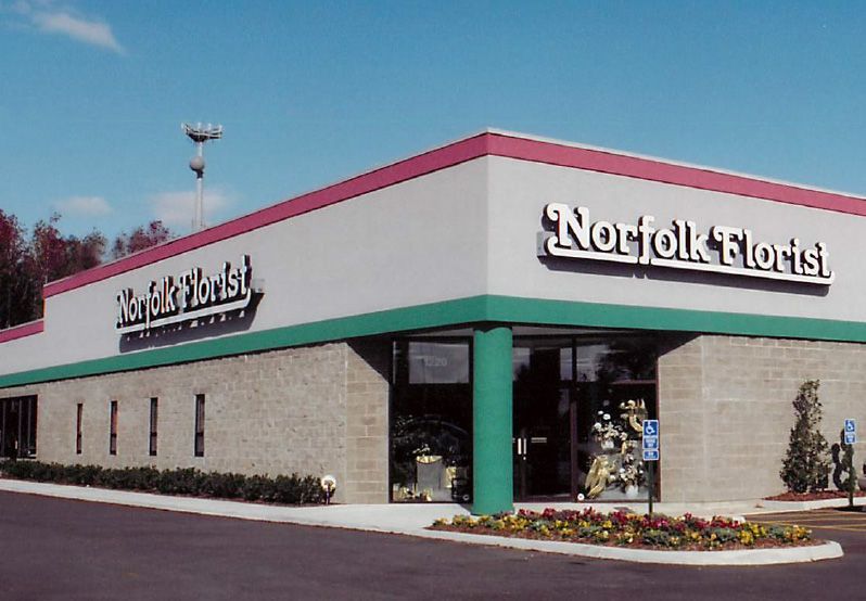 A norfolk florist building with flowers in front of it