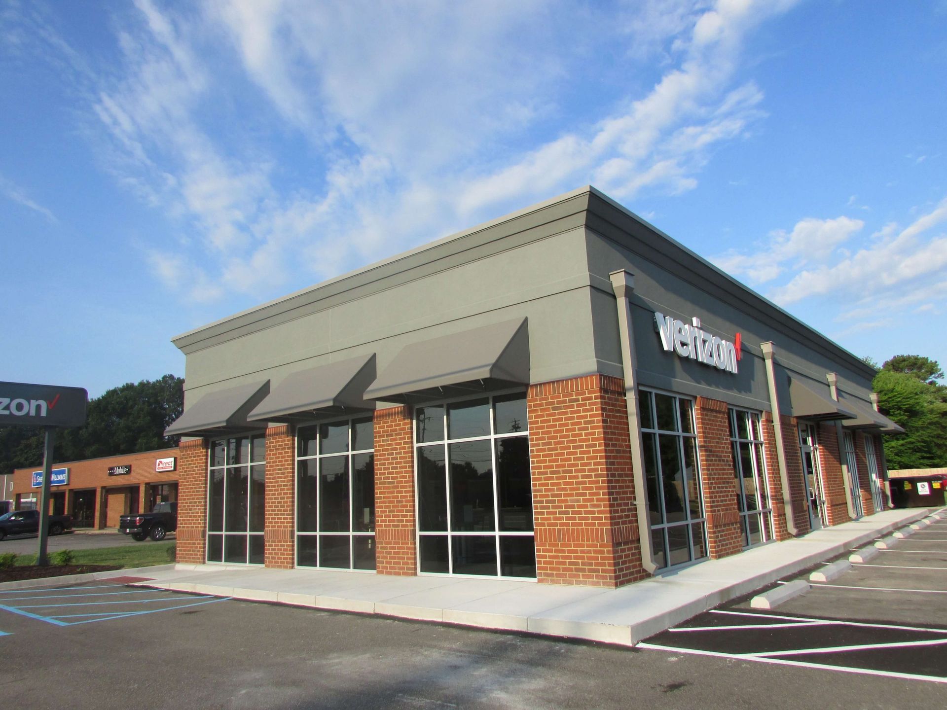 A verizon store with a lot of windows and awnings