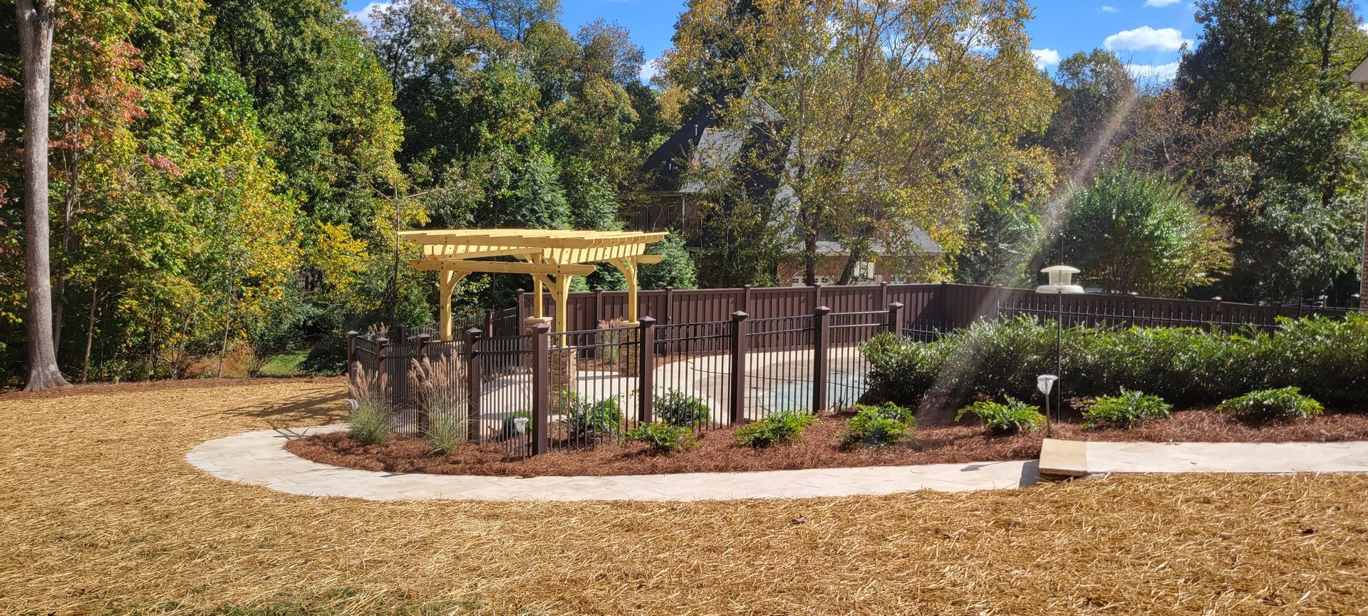 There is a sprinkler in the middle of the park.