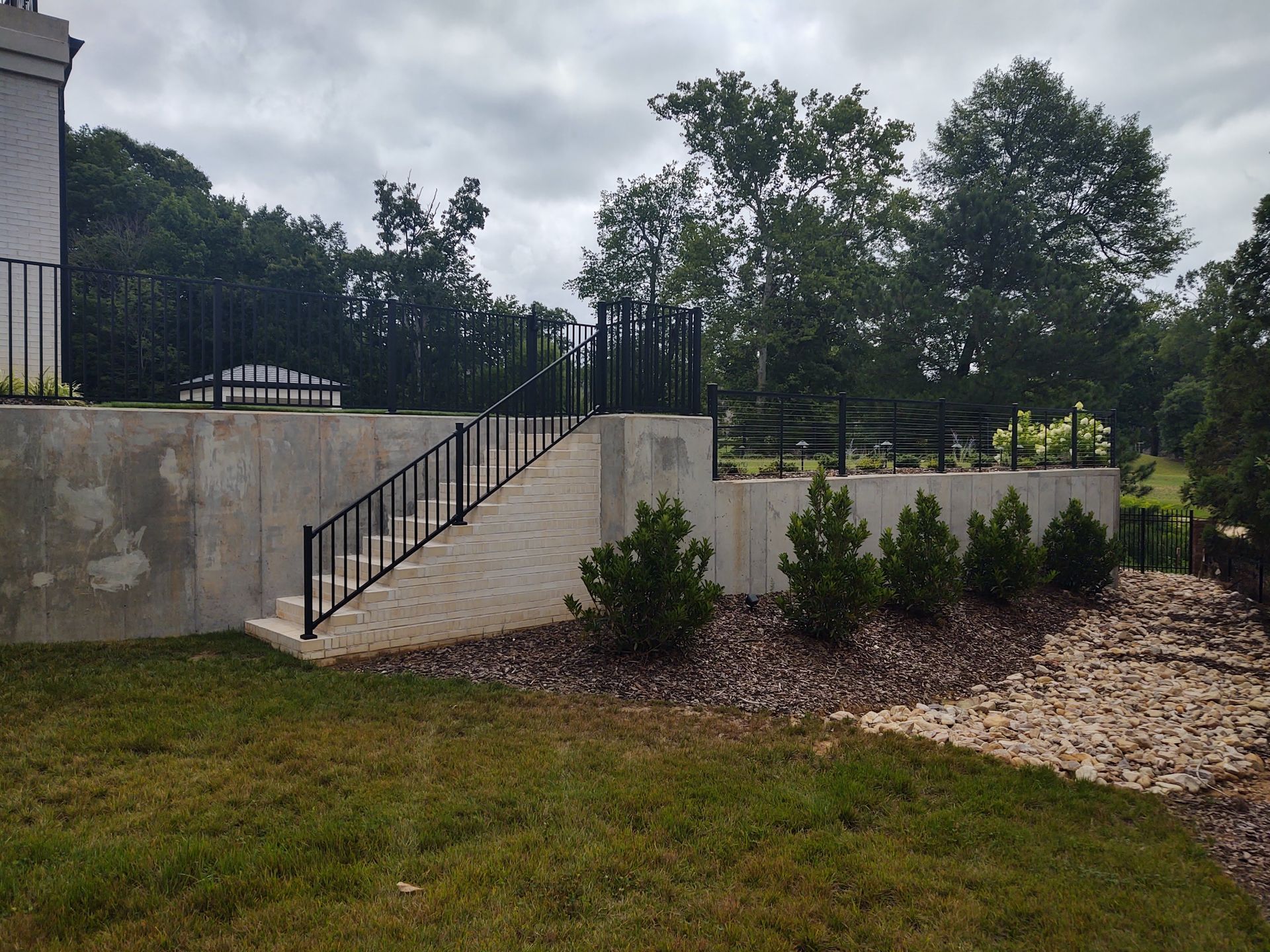 A concrete wall with stairs leading up to it