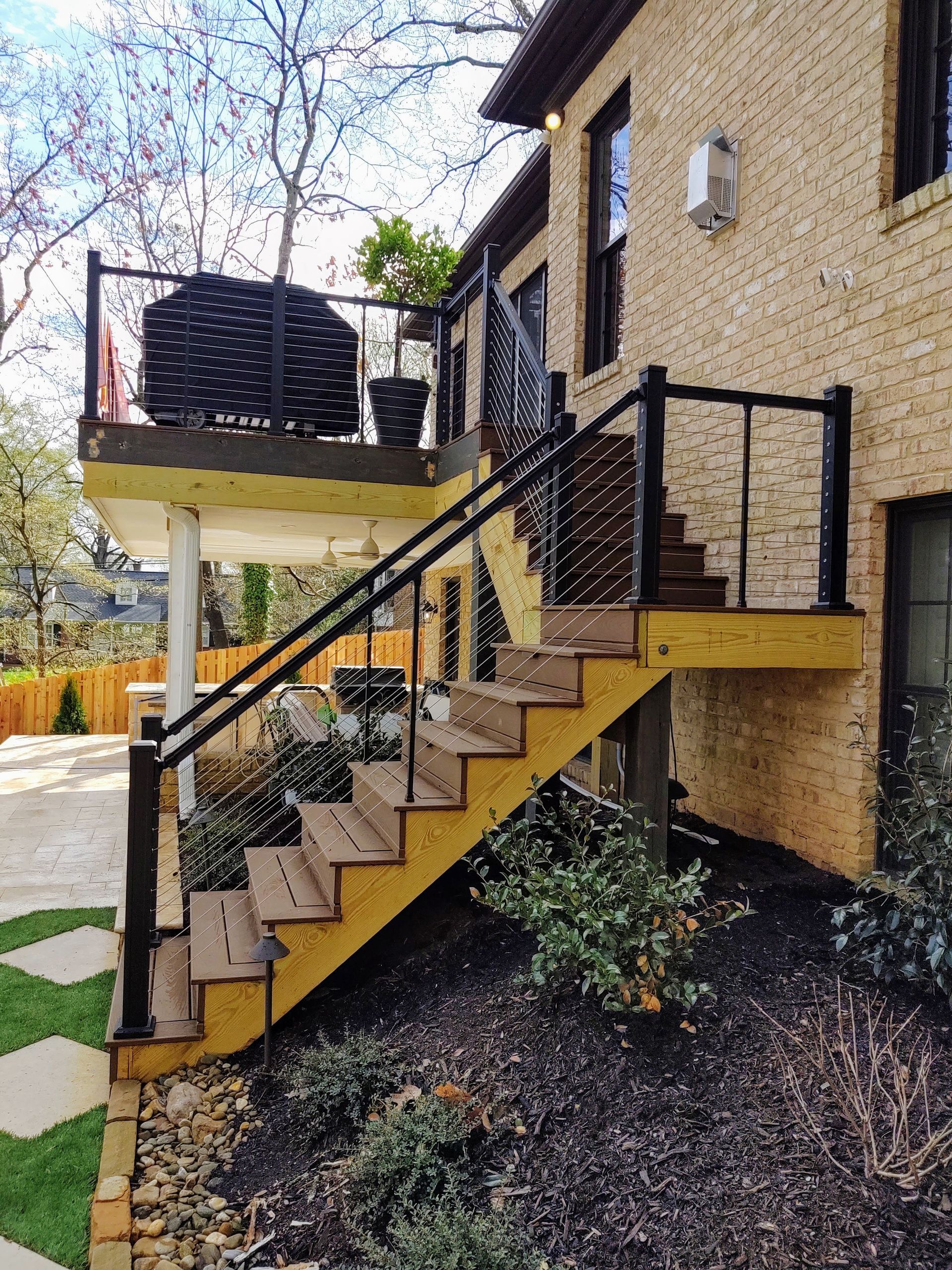 A wooden deck with stairs leading up to it